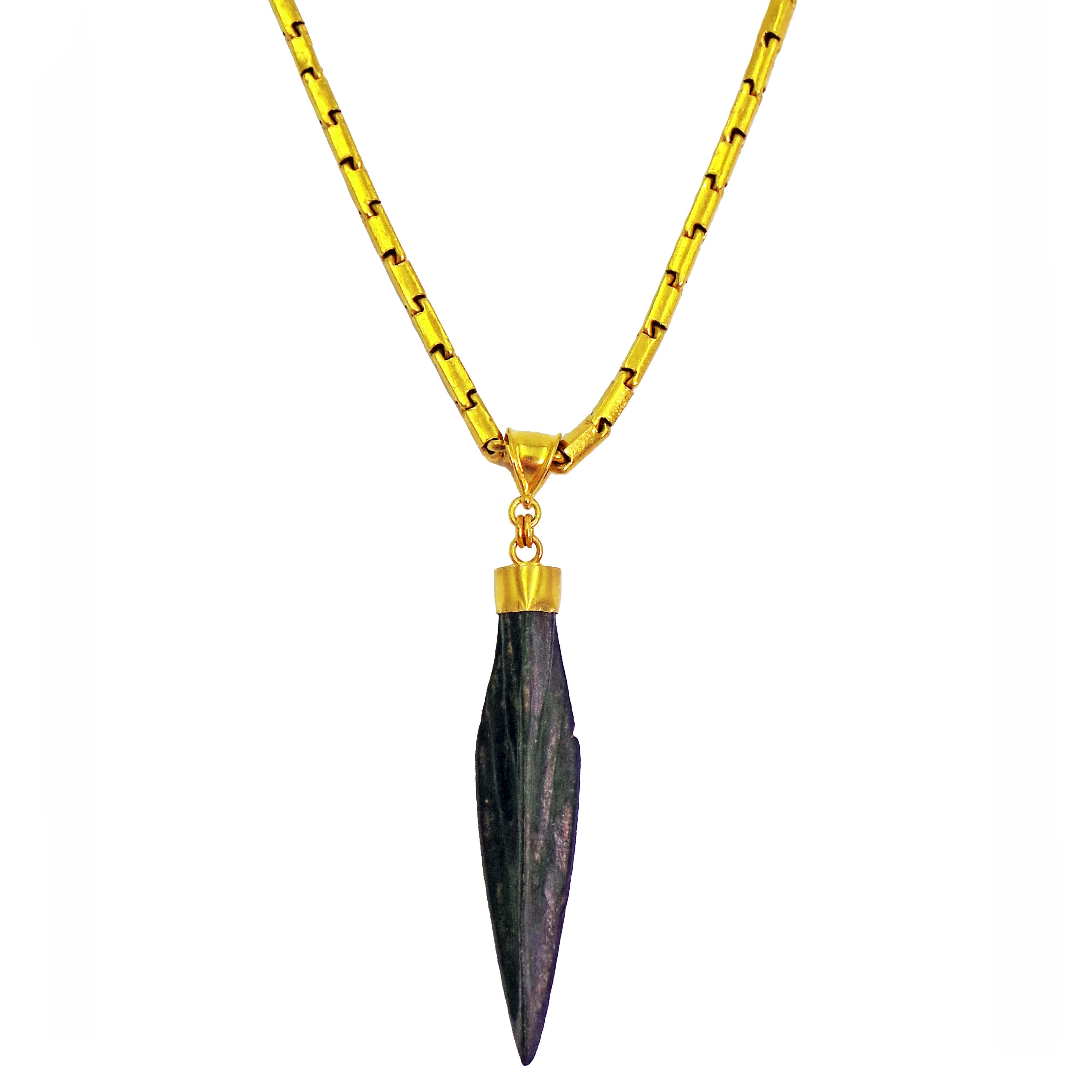 Authentic ancient Roman bronze arrowhead artifact set in a 22k gold pendant. Pendant is on a solid 22k gold 20 inch Baht chain finished with a hammered hook closure. Arrowhead pendant, including bail, is 2.32 inches in length. Unique, rich and