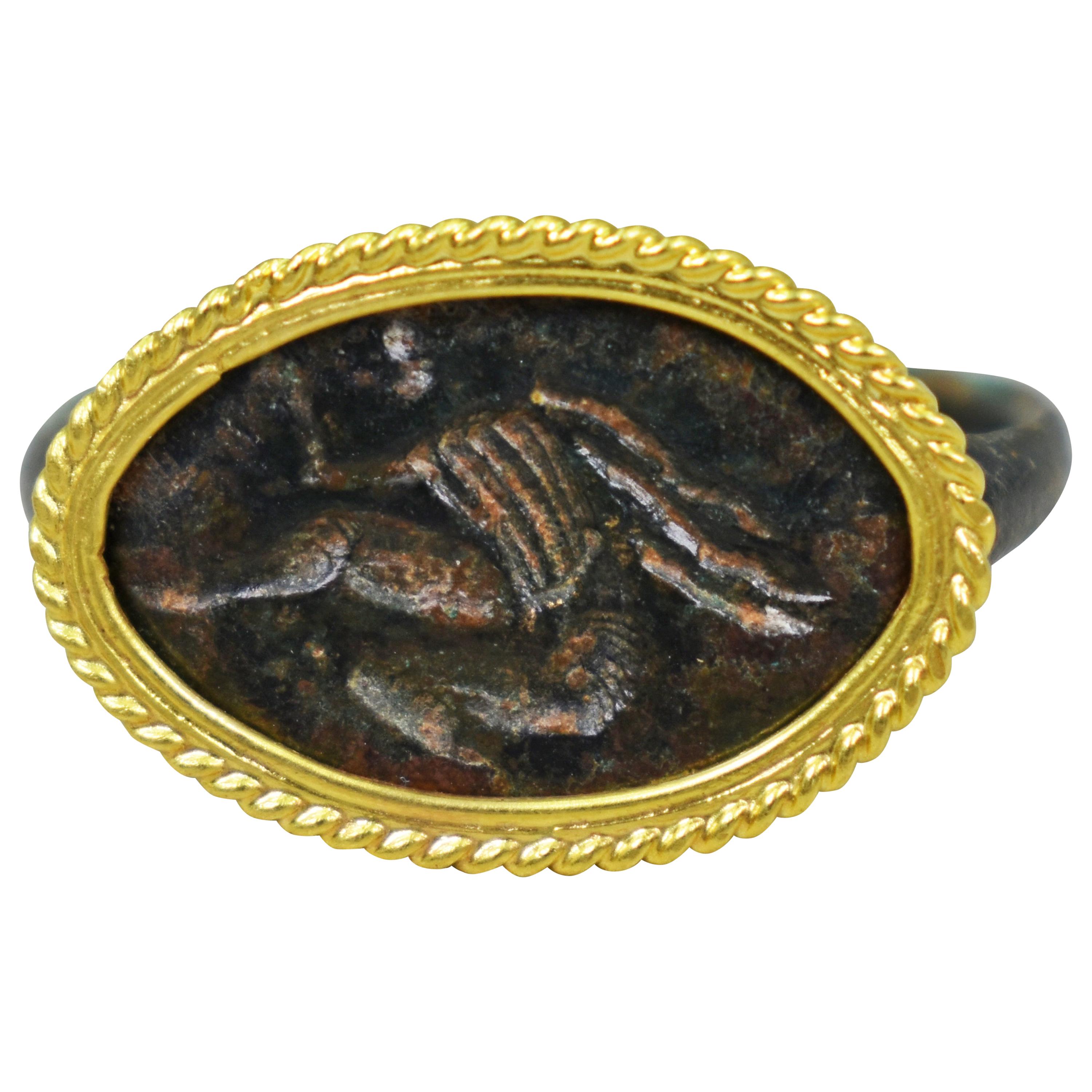Ancient Roman Bronze Carved Signet Ring with 22 Karat Gold Rope Bezel