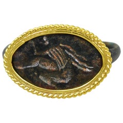 Antique Ancient Roman Bronze Carved Signet Ring with 22 Karat Gold Rope Bezel
