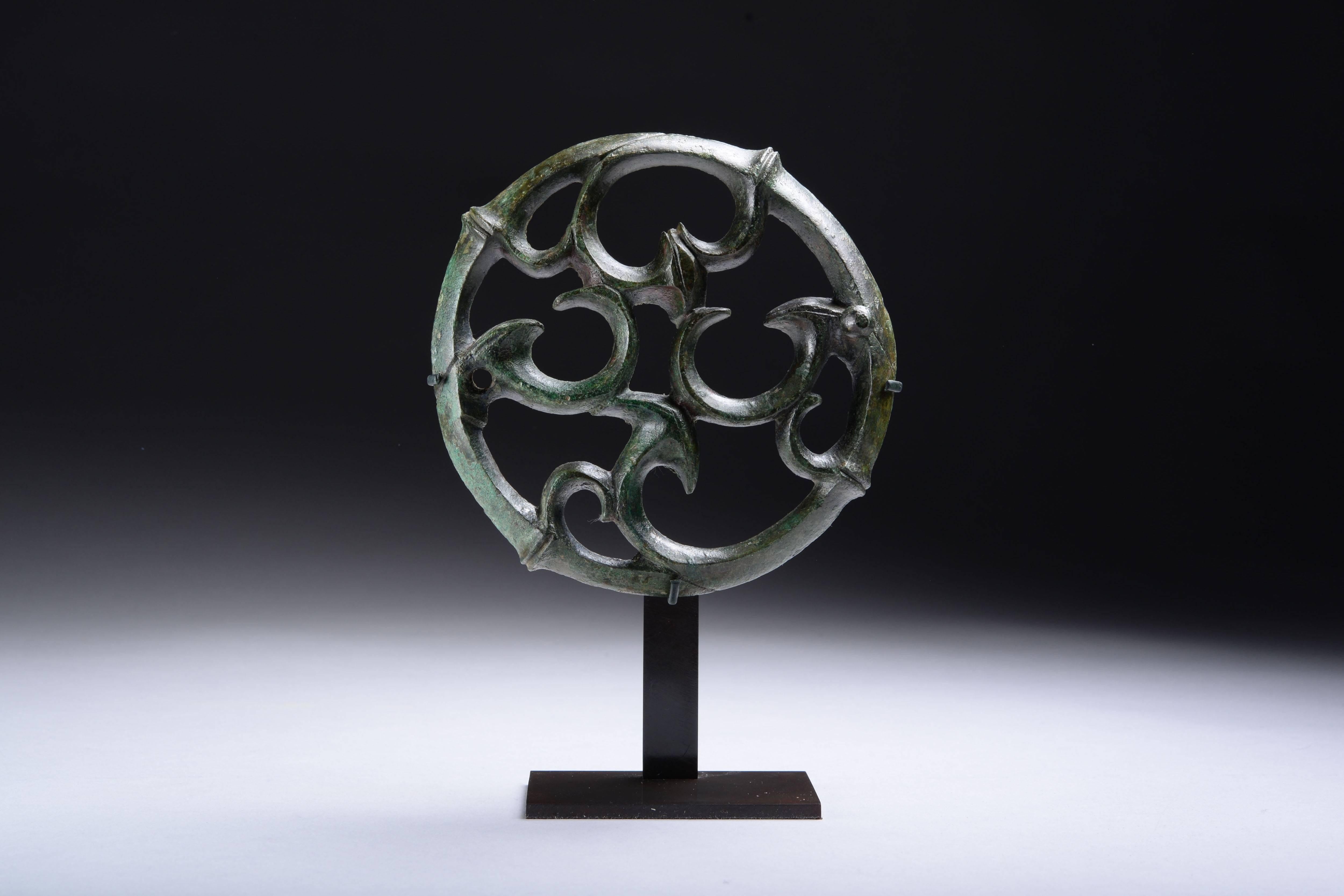 An ancient Roman bronze fitting, perhaps from a chariot or an embellishment from a piece of furniture, dating to the 1st-3rd Century AD

The style is reminiscent of Celtic La Tene art, with its organic, curvilinear forms, suggesting that this may