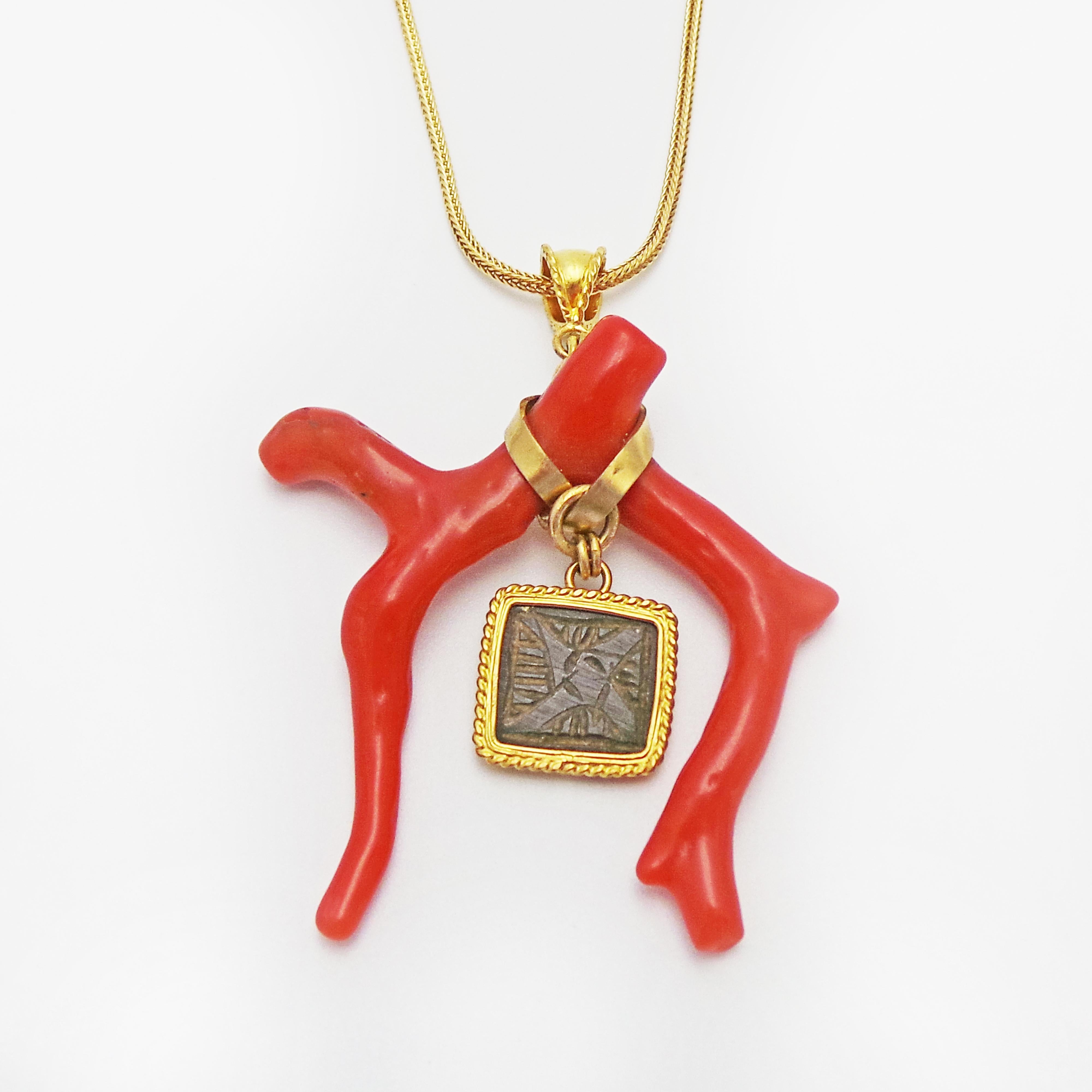Authentic ancient Roman bronze square artifact with carved, intaglio floral decoration (1st-3rd century AD) dangles in an organic branch coral pendant set in 22k yellow gold on an 18k yellow gold foxtail chain. Coral is the color of 2019. 