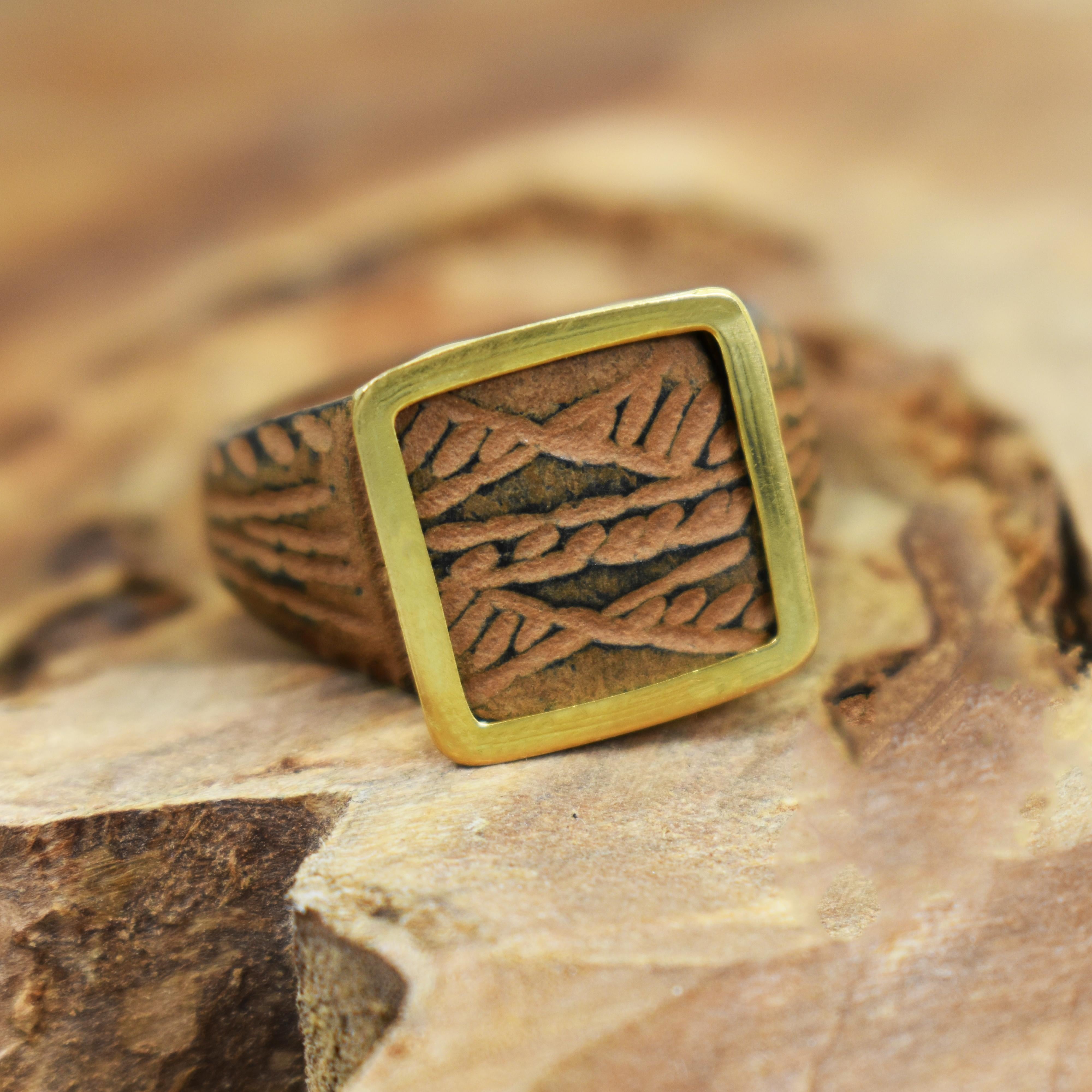 Authentic ancient Roman carved bronze signet ring (1st-4th century AD) with newly added 22k yellow gold bezel. Ring is approximately size 7. Square ring top measures 0.57 inches (14.5 mm) in width and length. May be worn as a ring or as a pendant on