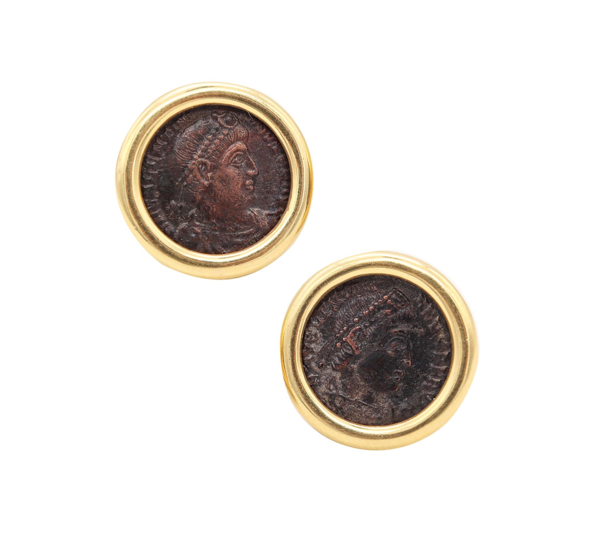 Pair of coin earrings with Ancient Romans Coins.

An elegant pair crafted in solid yellow gold of 18 karats, with high polished finish and suited at the reverse, with posts for pierced ears and hinged omega backs for fastening clips.

They are