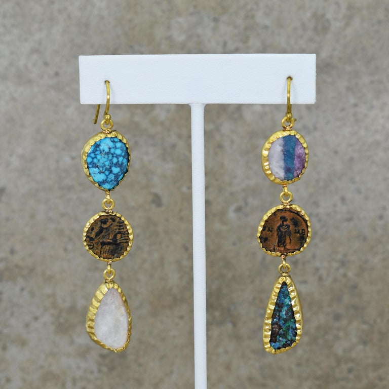 Hand-wrapped 22k yellow gold asymmetrical dangle earrings featuring Kingman Spiderweb Turquoise, Ancient Roman bronze coins, Moonstone, raw Paraiba Tourmaline and Australian Boulder Opal. Ancient Roman bronze coins include Constantine the Great