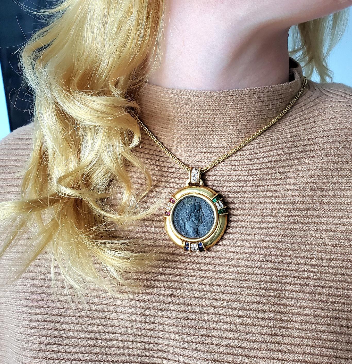 Ancient Roman coin pendant designed by Jean Paris.

An oversized pendant mounted with an ancient Roman bronze coin, created in Paris France by Jean Paris, back in the late 20th century. This beautiful pendant has been crafted with classic patterns