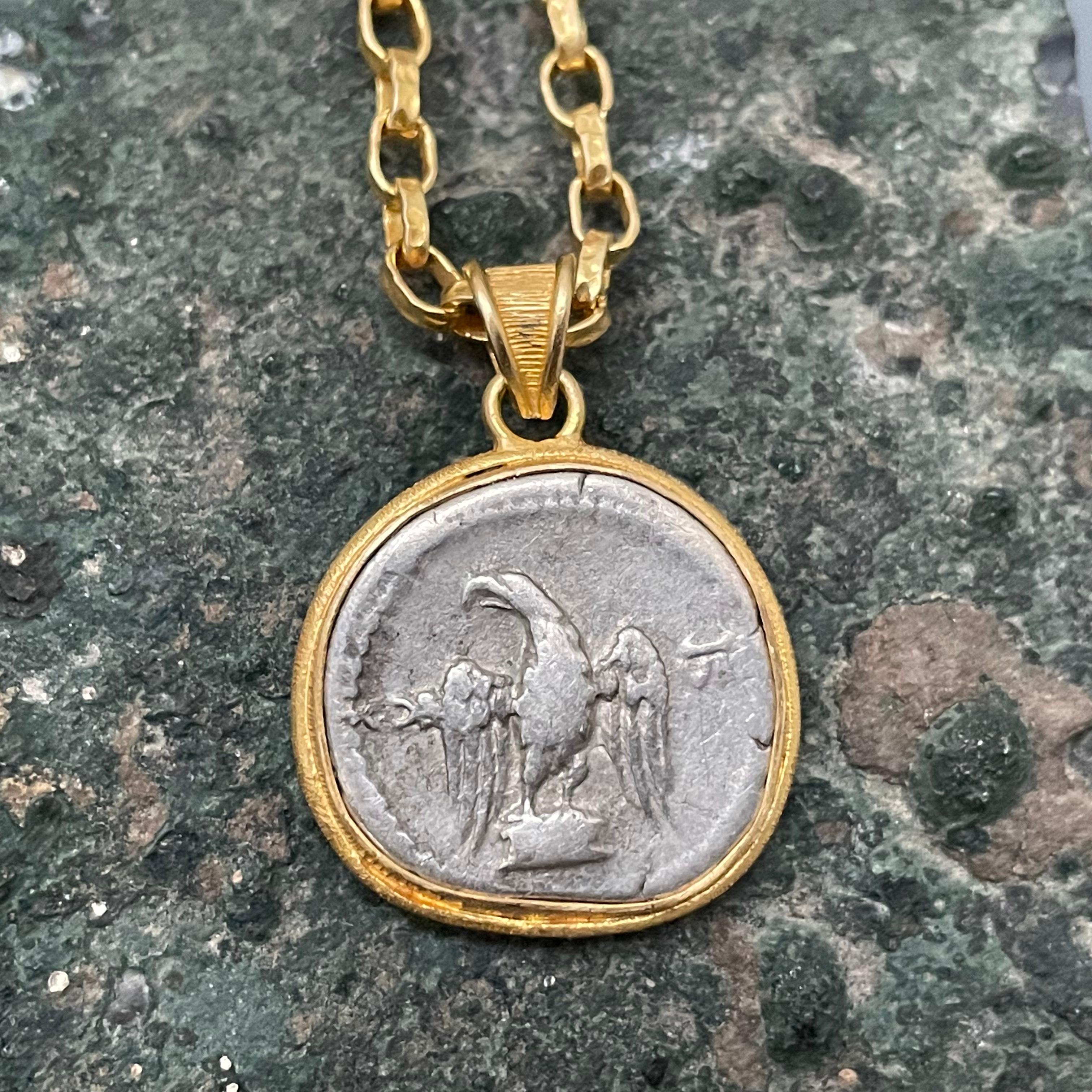 roman coin with bird on back