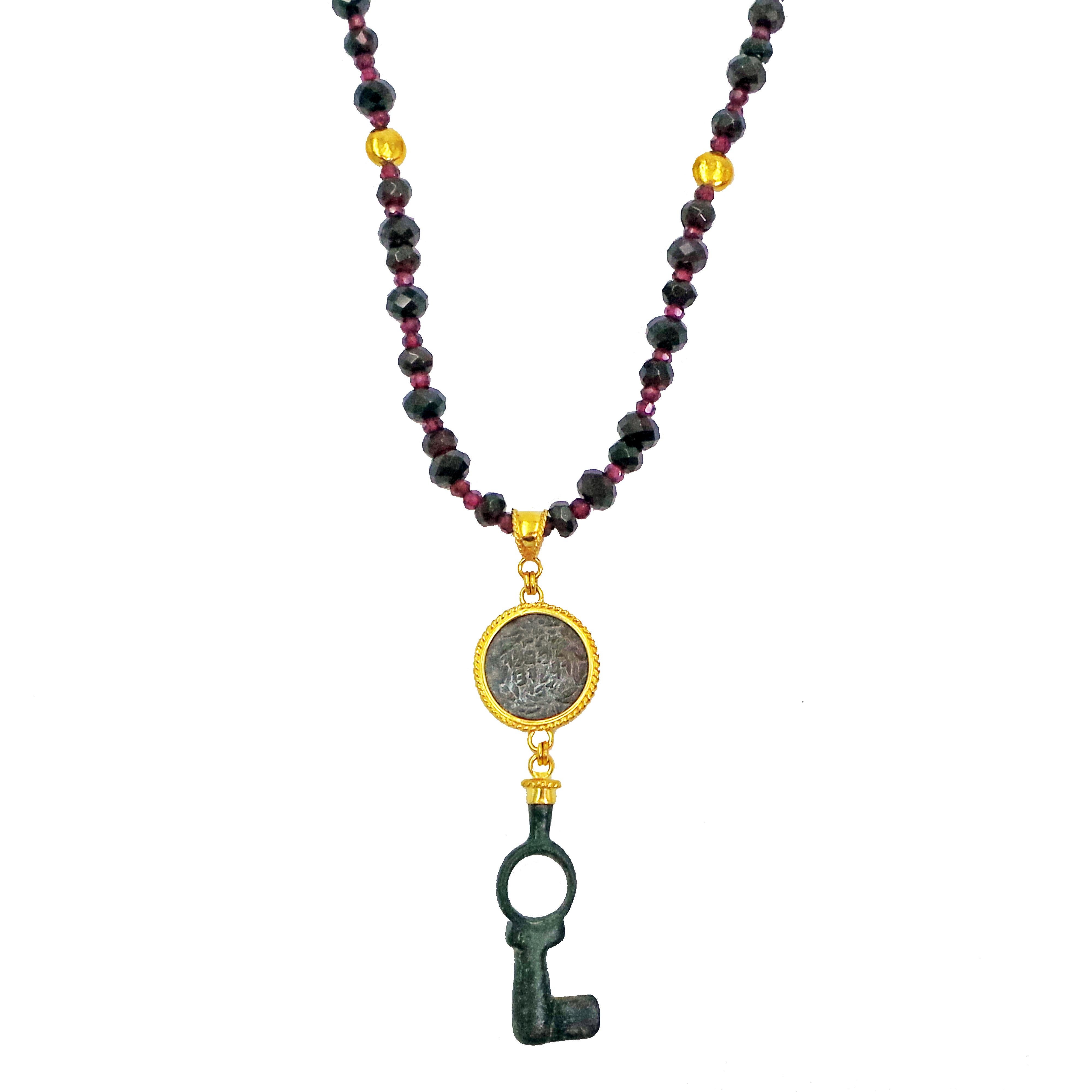 Authentic ancient stamped Roman glass and authentic ancient Roman bronze key 22k yellow gold dangle pendant on a faceted Garnet beaded necklace with two accent, hammered 22k gold beads. Necklace is 24 inches in length, and finished with a 22k gold