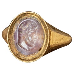 Roman Gold Ring with Amethyst Intaglio depicting a Bearded Man, 3rd century AD