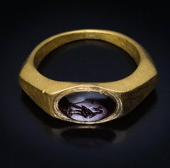 Ancient Roman Gold Ring with Garnet Intaglio of a Peacock c. 200 AD