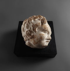 Ancient roman Head of Eros, in white marble, circa 2nd - 3rd century A.D