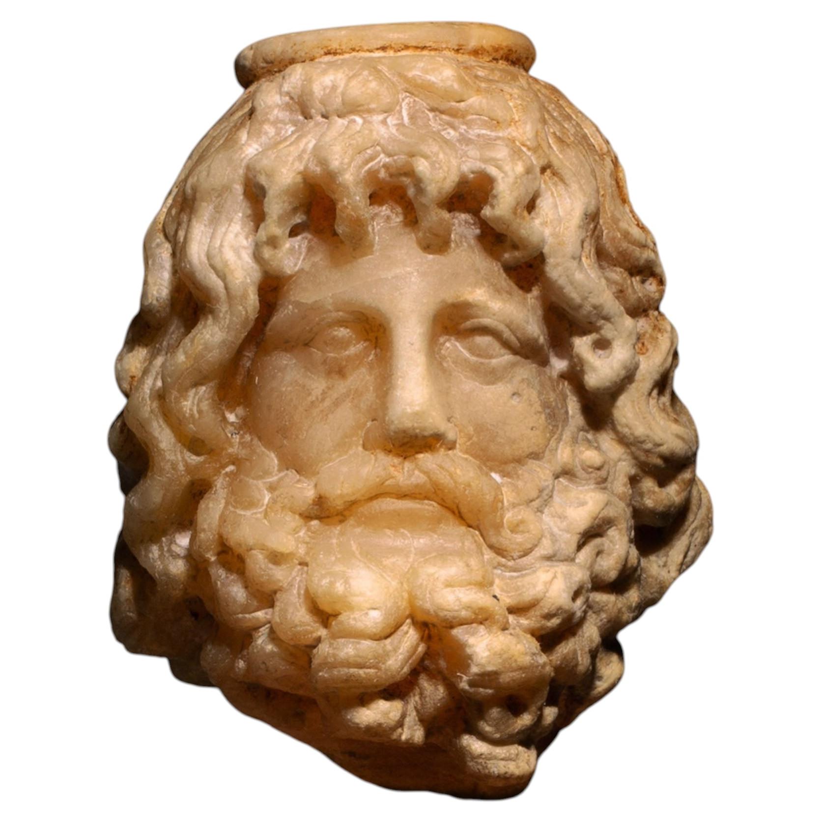 Tête romaine antique du dieu Sérapis en albâtre