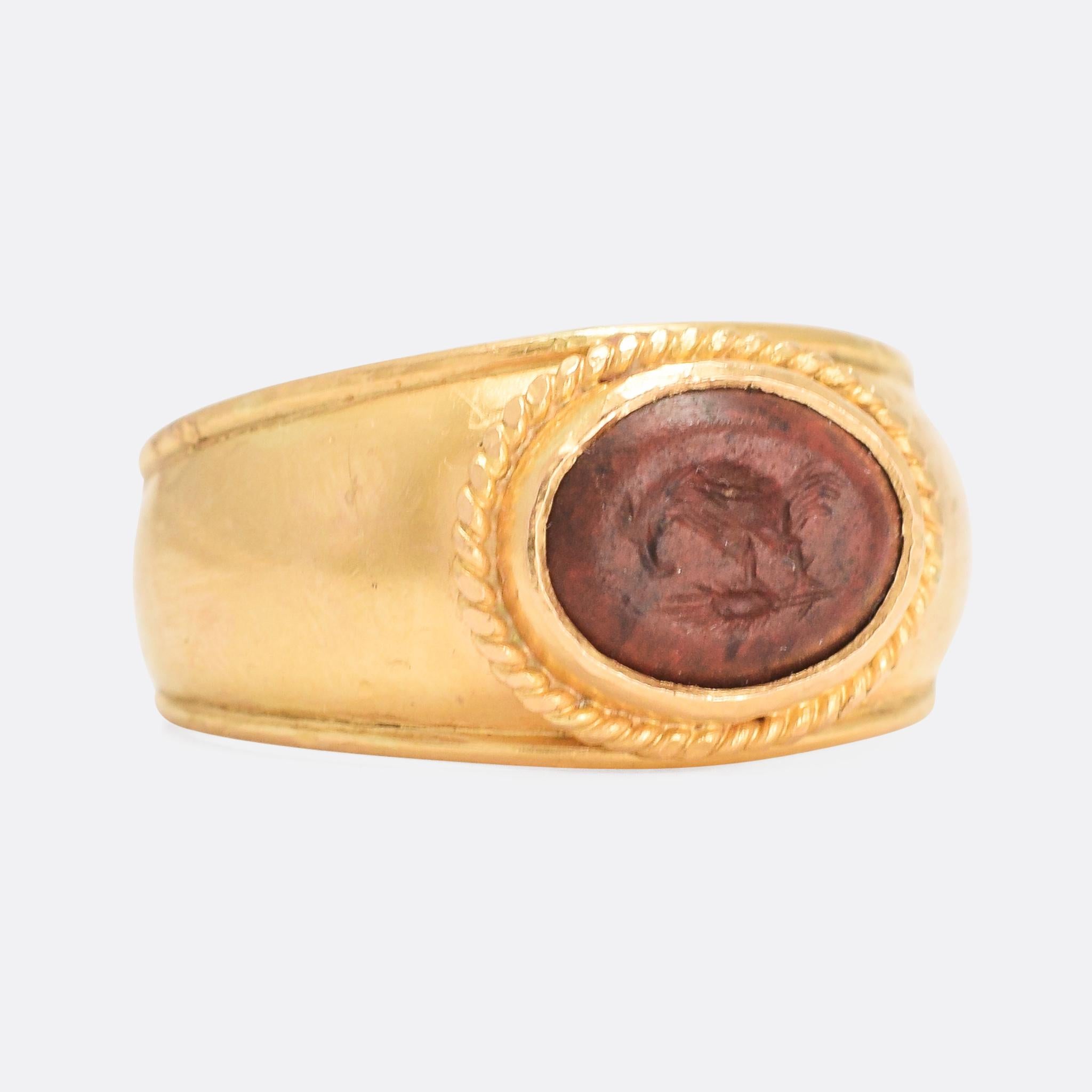 A superb Roman intaglio mounted in a Georgian era ring. The jasper stone has been carved with a chicken pecking at the ground. The rooster/hen have strong symbolism in Western literature... the rooster as a symbol of paternal and spiritual love; the