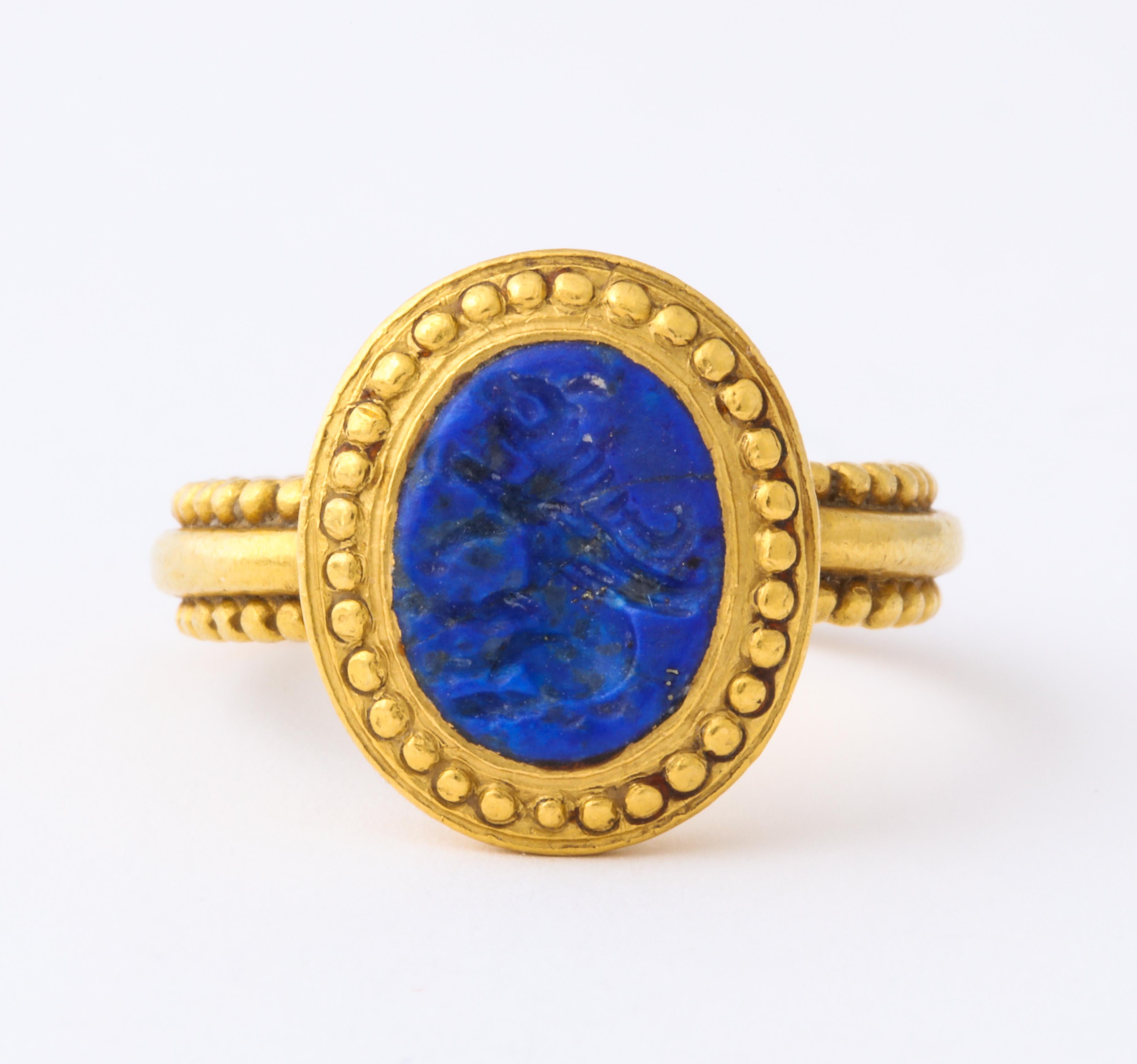 The beaded shank and face  of this magnificent Roman Sassanian ring c. 600 AD, is set in high carat gold with a rare lapis intaglio of an animal significant in its day of creation. The influence of design is a confluence of Iranian and Roman. The