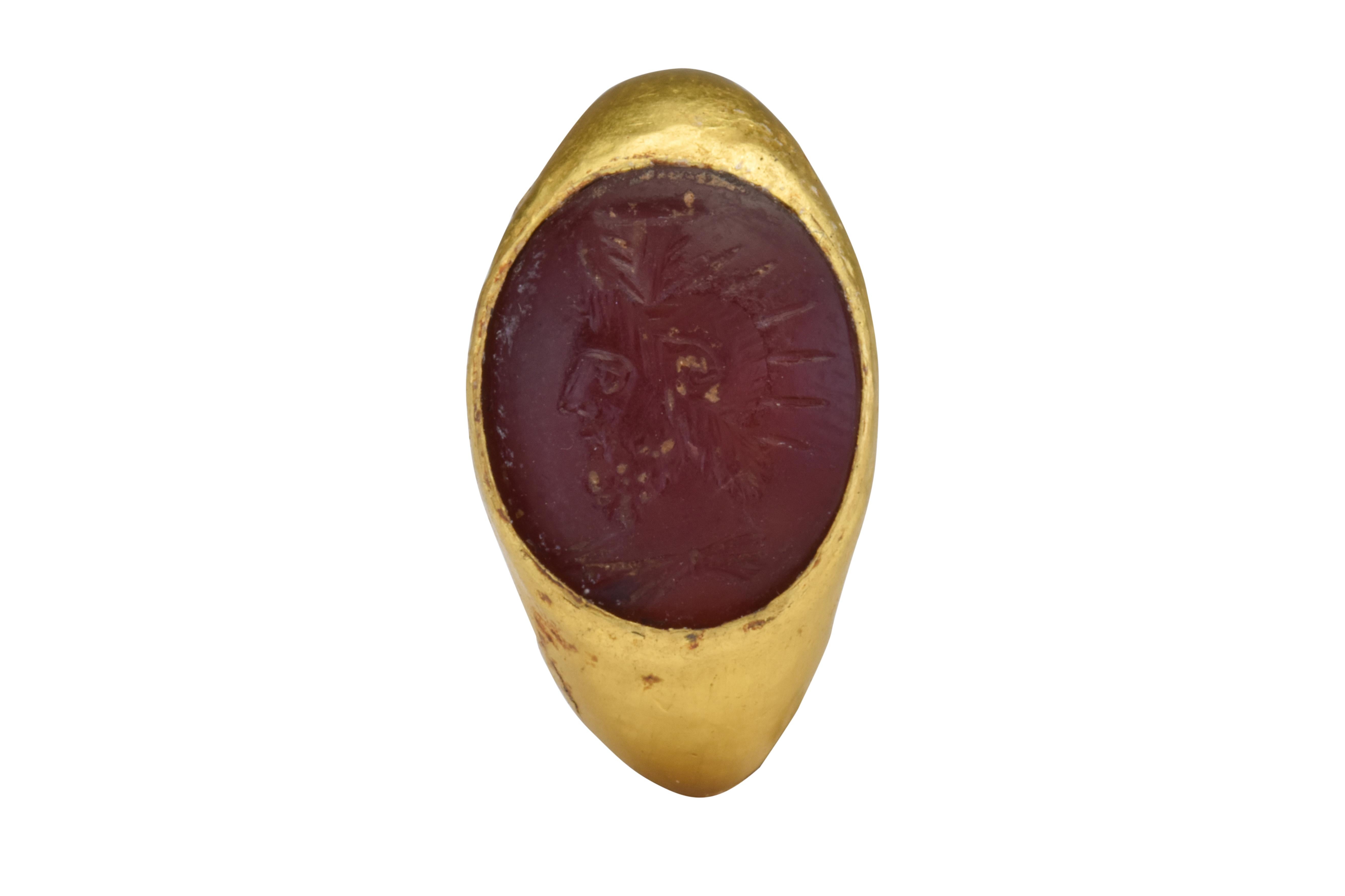 Ancient Roman Signet Carnelian Intaglio of a Warrior in Gold Ring

Ca. 100-200 AD

Nicely carved Centurion with helmet, facing left in a carnelian intaglio of 23K gold, nicely detailed.

Size: D: 3 5/8mm / US: 14.56 / UK: G 1/2; 3.61g

Provenance: