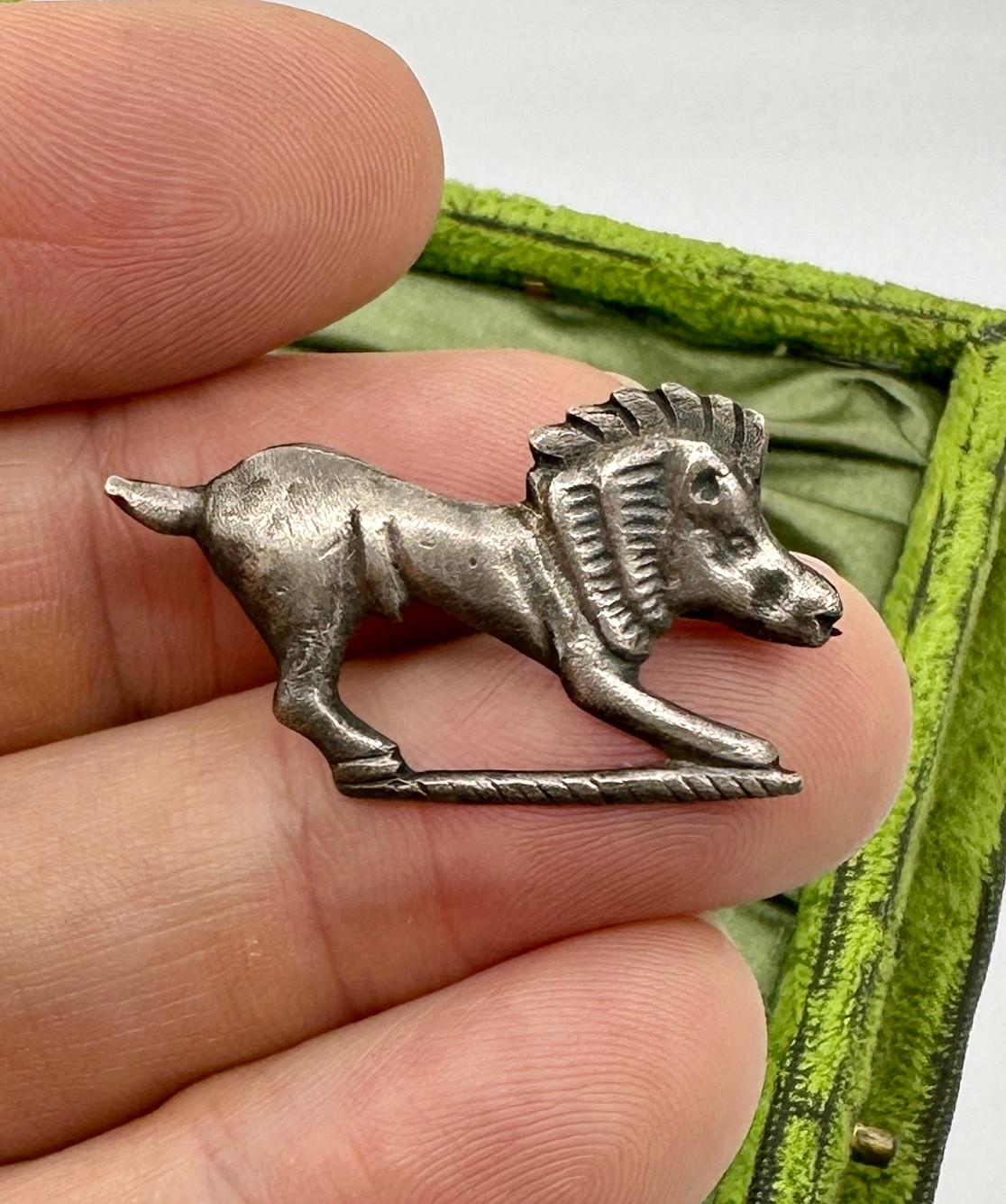 Unveil the elegance of antiquity with this Ancient Roman Silver Boar Fibula Brooch, dating from the 1st to 2nd century AD (1-200 AD).   The finely crafted ancient artifact is a testament to Roman artistry.  The brooch features an exquisite cast