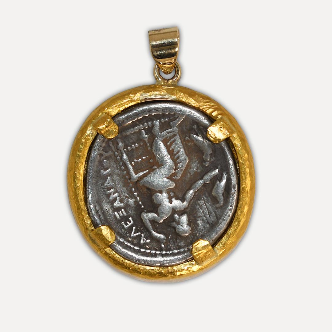 Ancient Roman silver tetradrachm in custom 22k yellow gold bezel.
The bezel tests 22k and weighs 18.2 grams net.
The bale for the chain is 14k.
The coin is an authentic ancient coin featuring Alexander the Great,13.2 grams,
very fine details,325