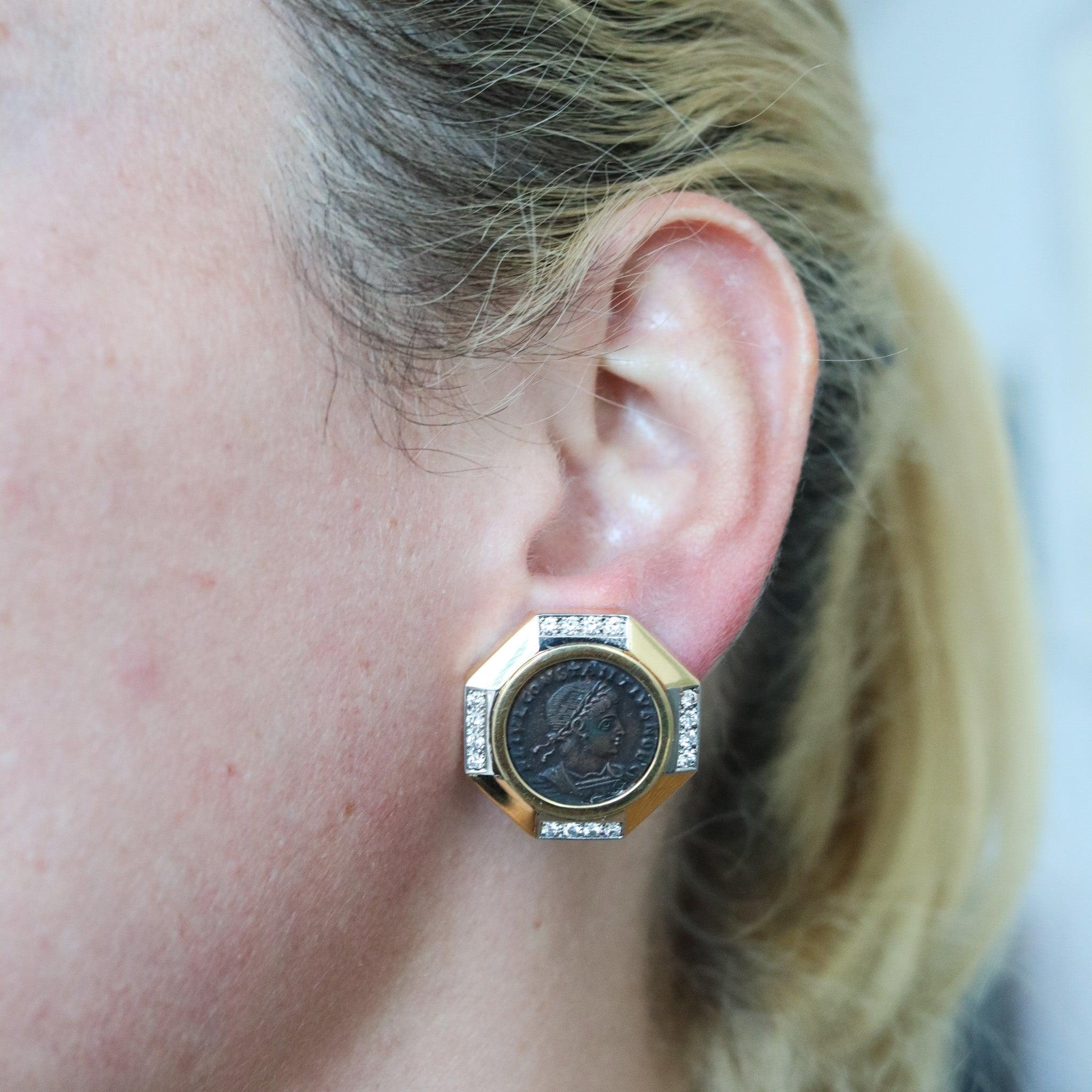 Pair of earrings with Ancient Romans Coins.

An elegant pair of modernist ancient-coins earrings, crafted in Italy in solid yellow gold of 18 karats and platinum parts for the setting of the diamonds. Created with octagonal shapes and professionally