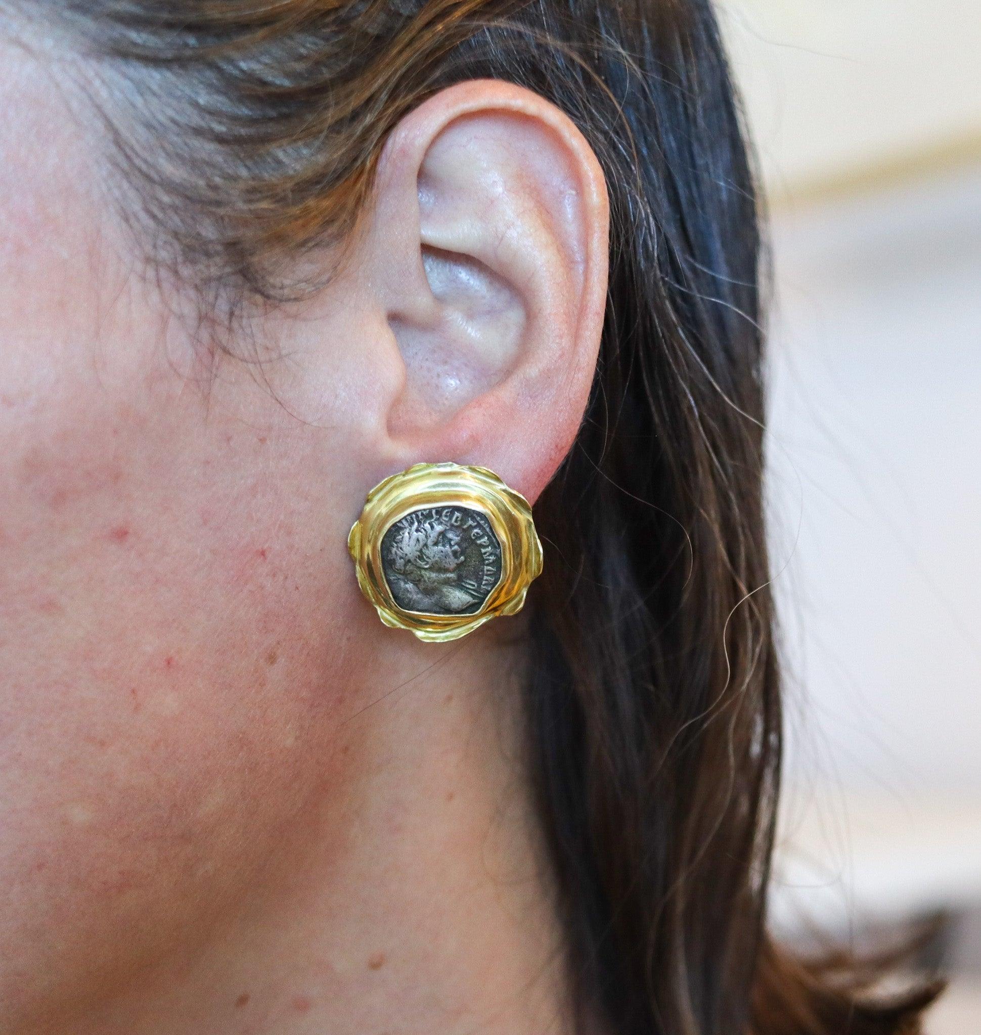 Pair of earrings with Ancient Roman Empire coins.

This is a stunning pair of clips-on earrings mounted with two genuine ancient silver denarius coins from the Roman Empire. The earrings frames were crafted with irregular shapes to reinforce the