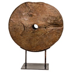Used Ancient Rustic Cart Wheel Mounted on Black Lacquer Base, Weathered Patina