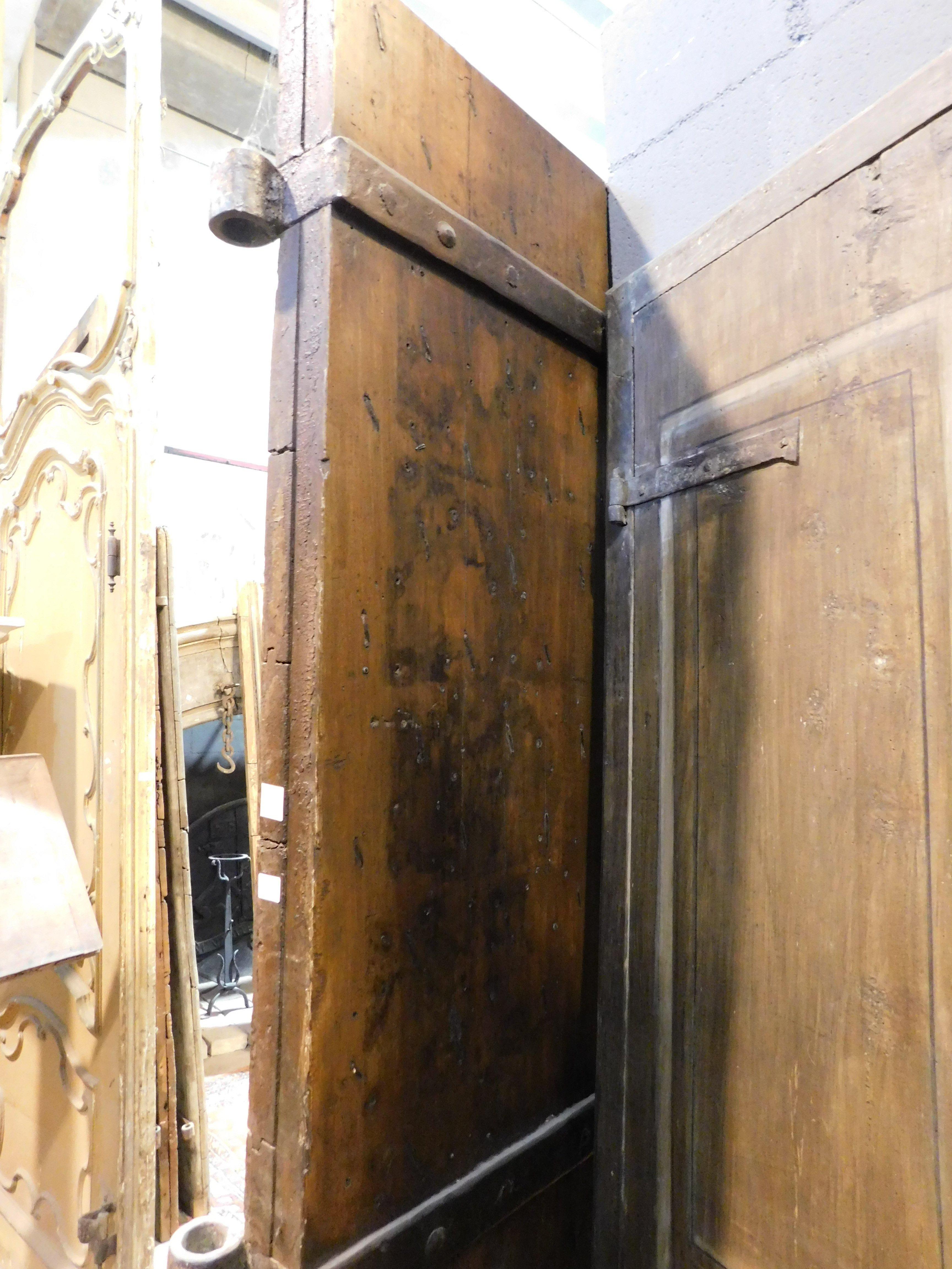 Walnut Old Rustic entrance door in walnut with nails, from northern Italy For Sale