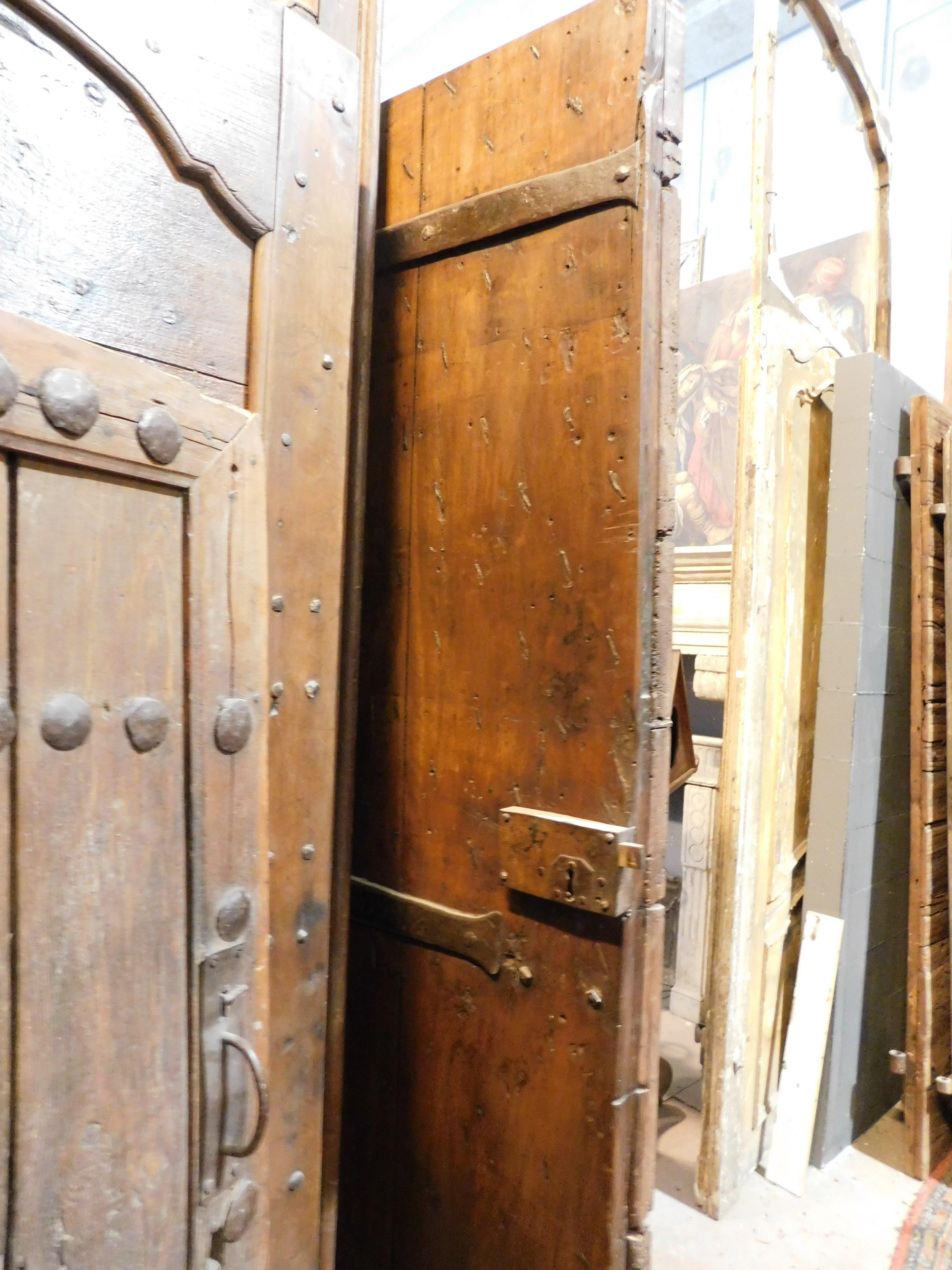 Old Rustic entrance door in walnut with nails, from northern Italy For Sale 1