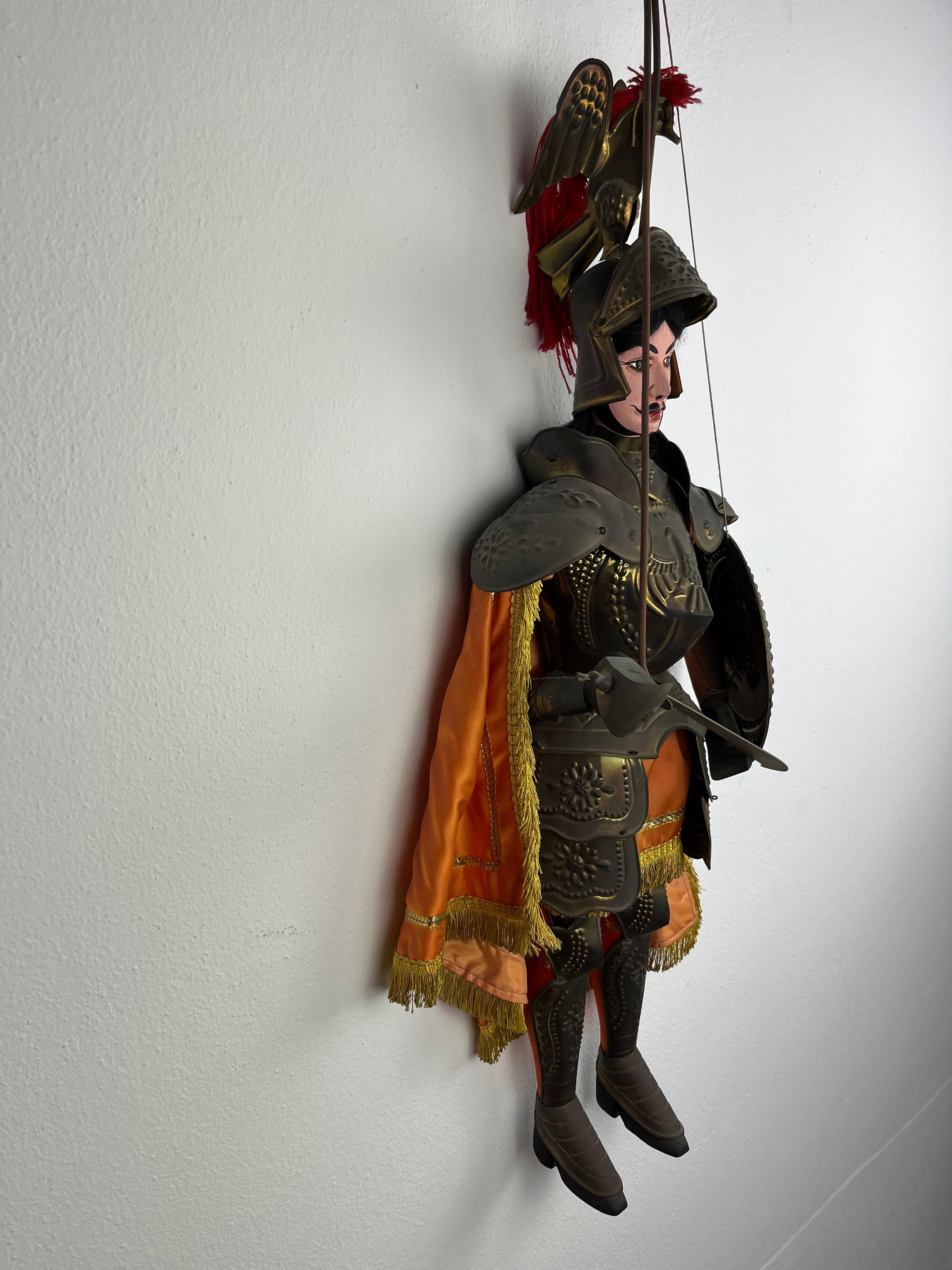 Ancient Sicilian puppet, 1940s.
74 cm tall, the work of a master puppeteer from Palermo. It represents Rinaldo, a fictional character belonging to the Carolingian cycle, one of the twelve paladins of France who make up the chosen guard of the