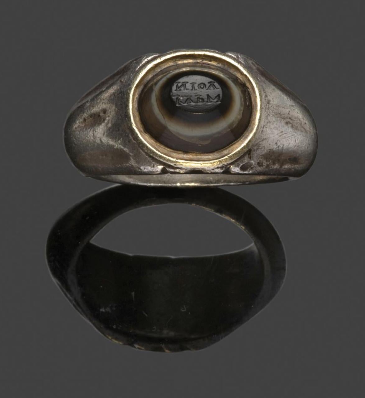 An ancient eye bead in later ca 1820 silver setting. Eye beads were as apotropaic “medicine�” or protective amulets against the evil eye.
Three layered truncated conical stone, with a small retrograde inscription.
Roman art. 1st - 3rd century AD
10 x