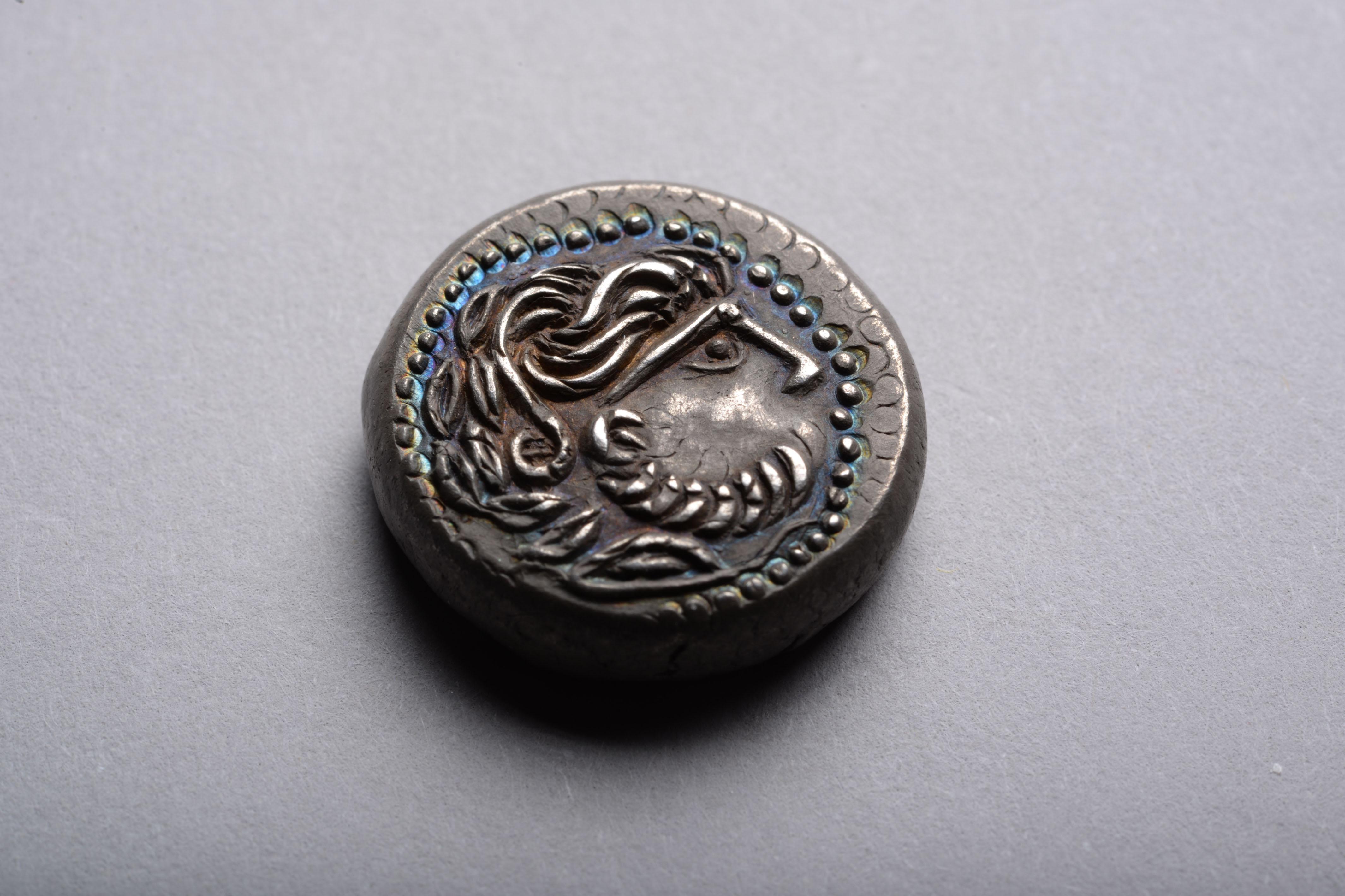 old coin with horse and rider
