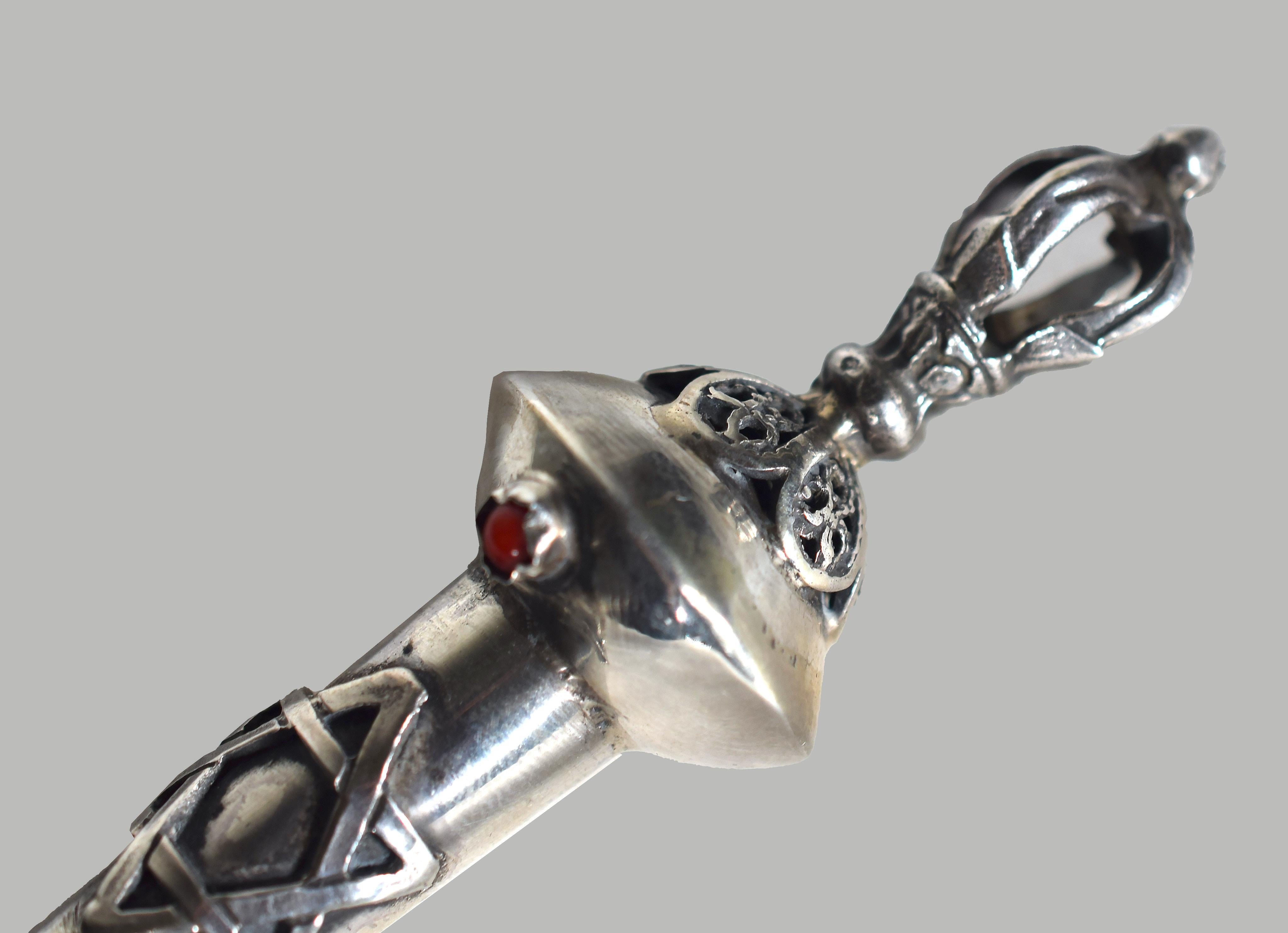 Ancient silver Yad Torah pointer is a precious decorative object realized in the 19th century.

Made entirely of silver and decorated with a little red stone on the top. Handcrafted by an Israeli artist.

The origin of the yad is uncertain: some