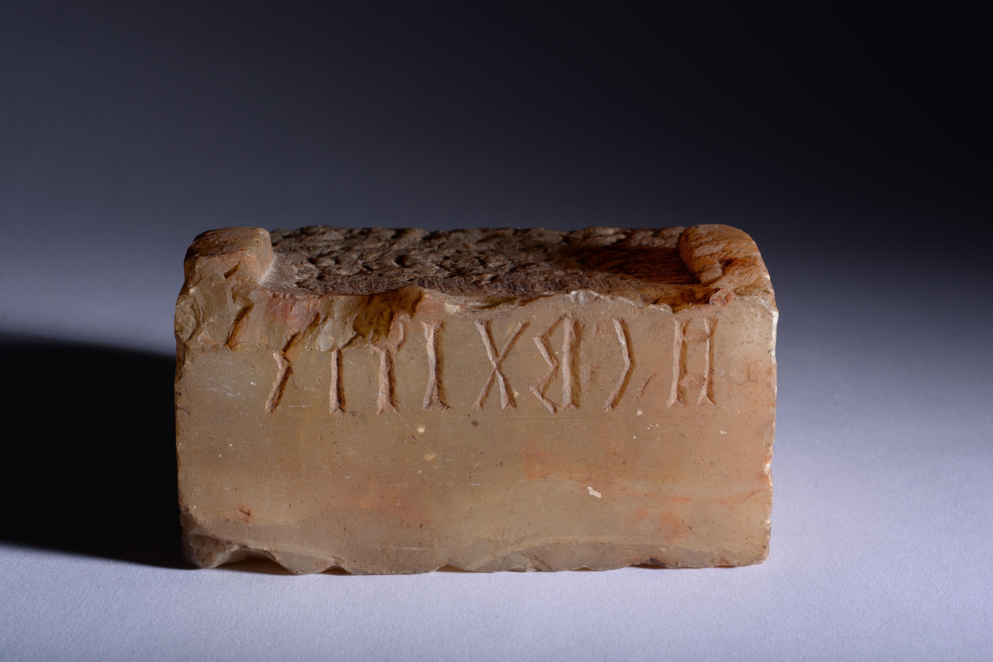 Base from a South Arabian Statue with Qatabanic Inscription
Alabaster
circa 1st century B.C.

‘’Consequently, neither white marble of Paros nor any other stone which men admire can be compared with the precious stones of Arabia, since their