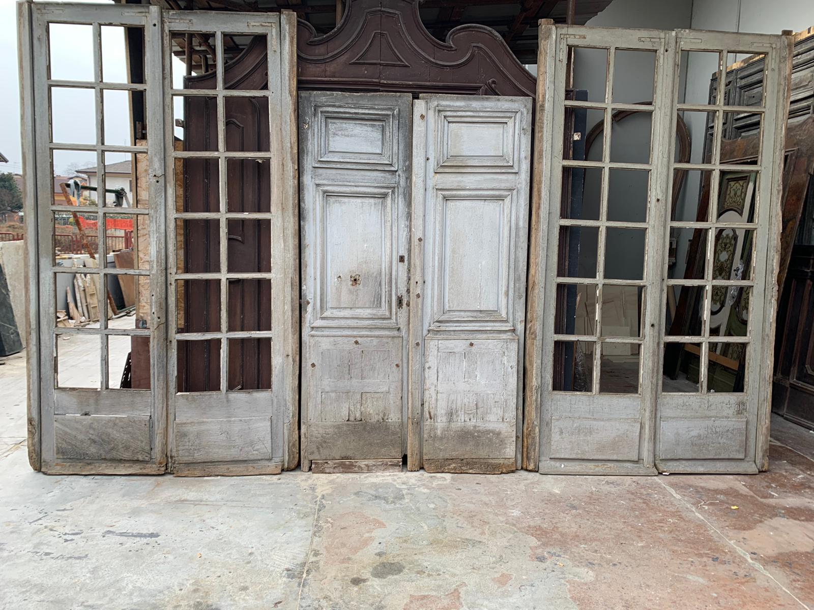 Ancient stained glass window with door, shop facade in light gray lacquered oak, built in the 1800s, from France, has two side windows that were closed and a central double leaf door, to be put back together and adapted to use, max size cm L 450 x H