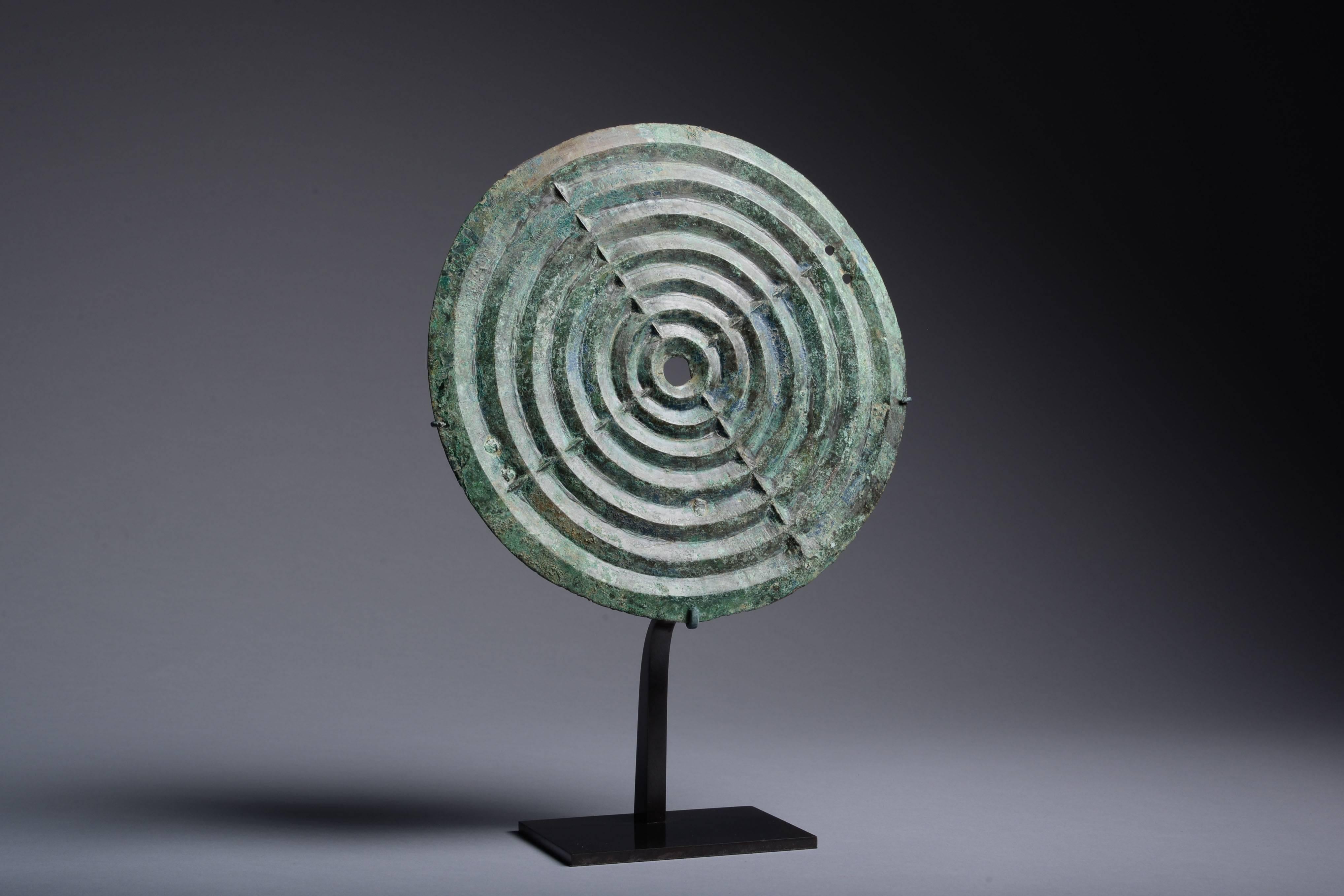 A heavy cast, thick plate of bronze covered with a beautiful green and blue patina.

The Villanovan period is regarded as the earliest phase of Etruscan civilisation. Archaeological evidence and ancient literature alike show that the Etruscans had a