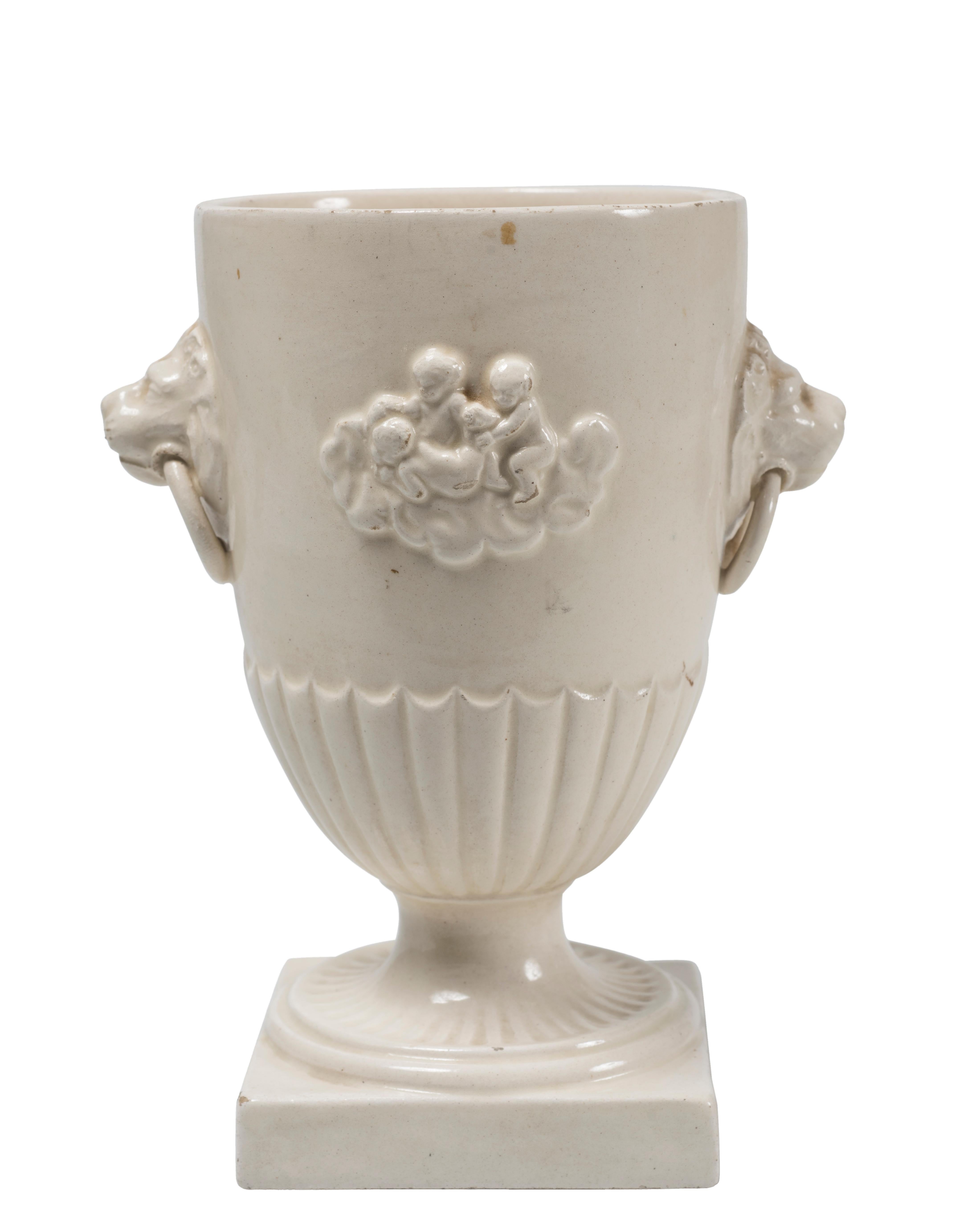 White Chalice cup is an original decorative object realized in the 19th century by the Giustiniani manufacture in Naples, Italy.

Del Vecchio factory. The artwork is realized in white earthenware decorated by reliefs on each side.

Very good