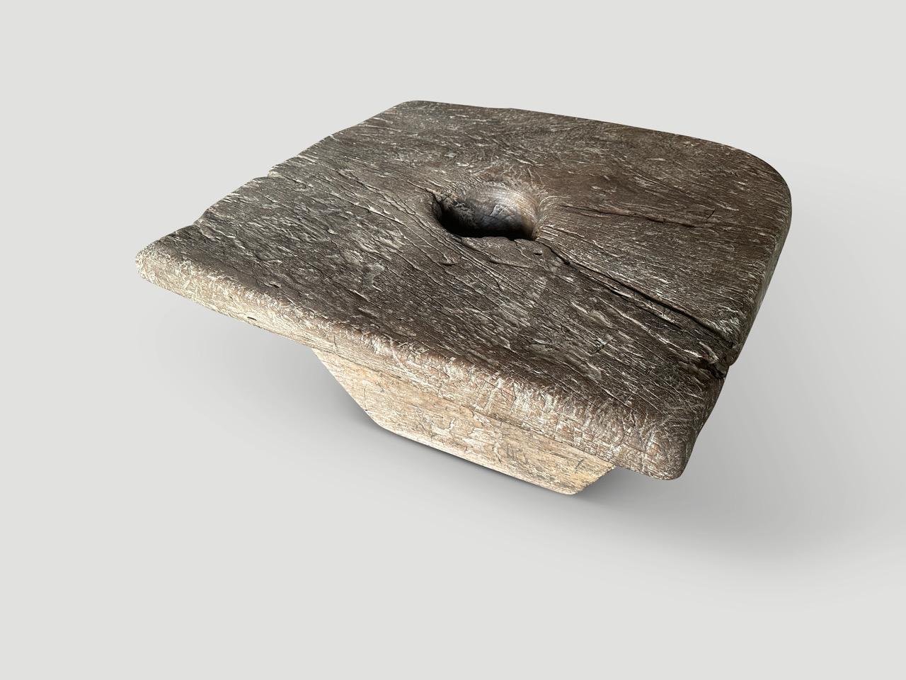 Impressive century year old mortar originally used to grind rice in the center. Both usable and a piece of art. Carved from a single piece of antique teak wood. The patina on this ancient teak wood is beautiful.

This coffee table was sourced in the