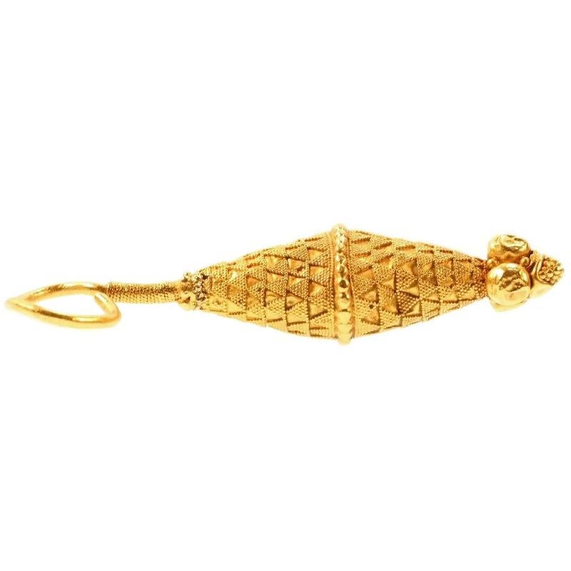 An ancient earring 4th-7th century AD in at least 18 karat yellow gold, granulation technique. It is a bit bent and shows some dents but that's not really exceptional considering it's age. Length 2.76 inch. Weight 8.20 gram.

A similar ear pendant