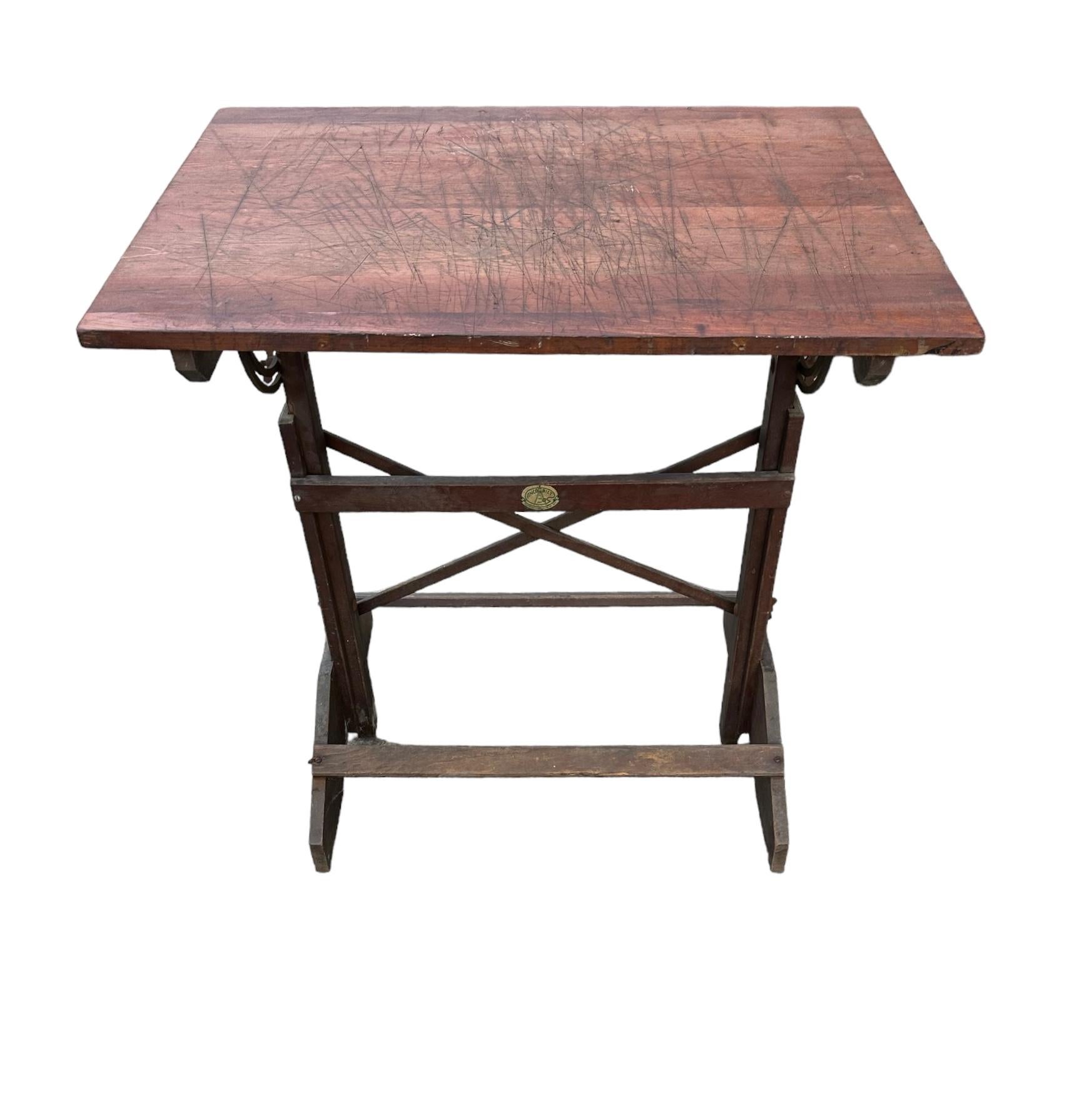 Elegant antique drafting table with adjustable height and angle. Made in Brooklyn by Anco Bilt, constructed of solid wood with metal hardware. A  relic of an earlier time, this table definitely has a hard earned heavy patina from use by an