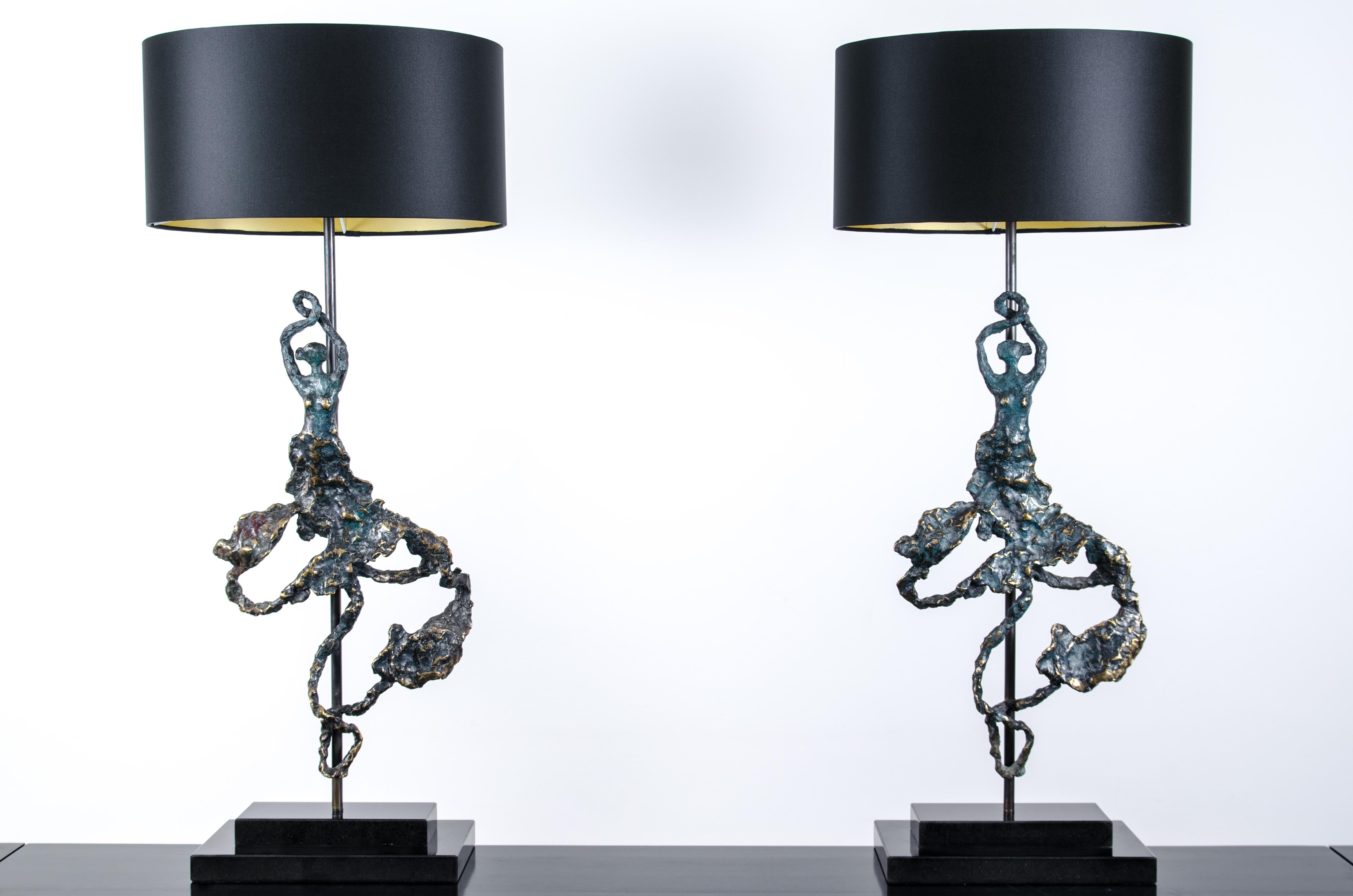 'Andalucia'  stunning duo of sculptural bronze table lamps , meticulously sculpted and handcrafted to embody the essence of Flamenco dance.  Inspired by the artist and designer's Spanish heritage, these lamps capture the graceful movements and