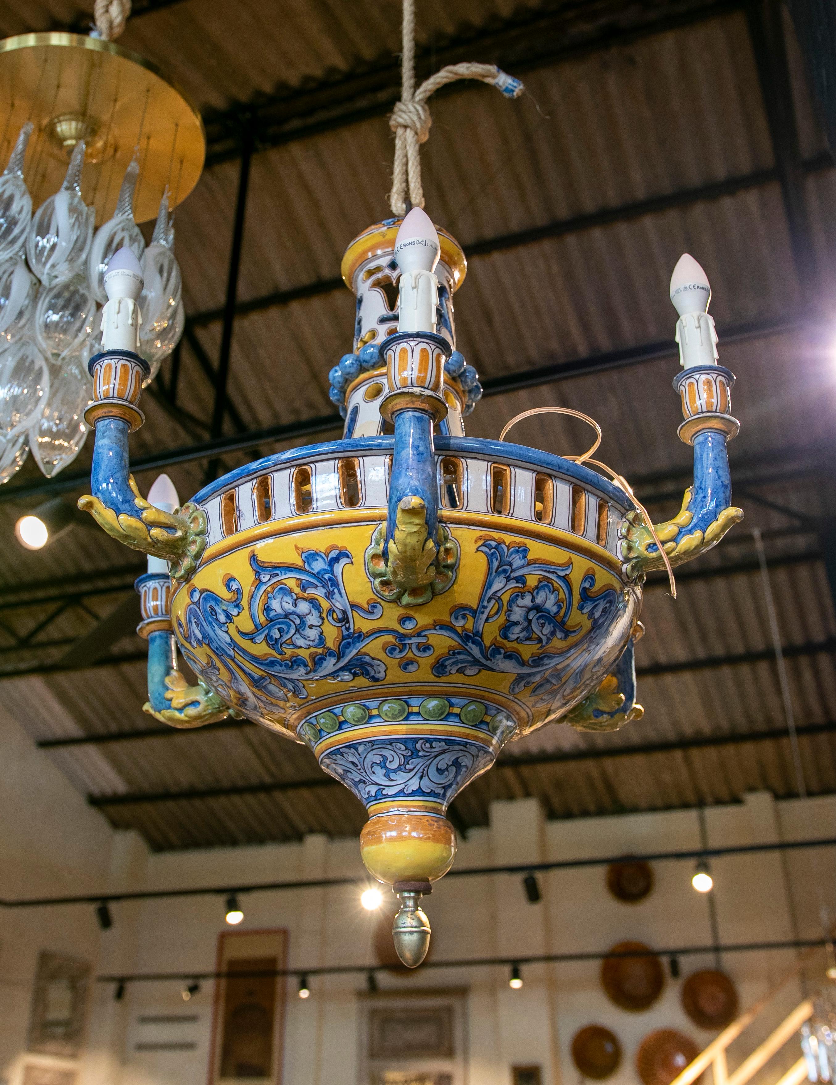Hand-painted Talavera  ceramic lamp in blue and yellow tones with vegetals motifs.