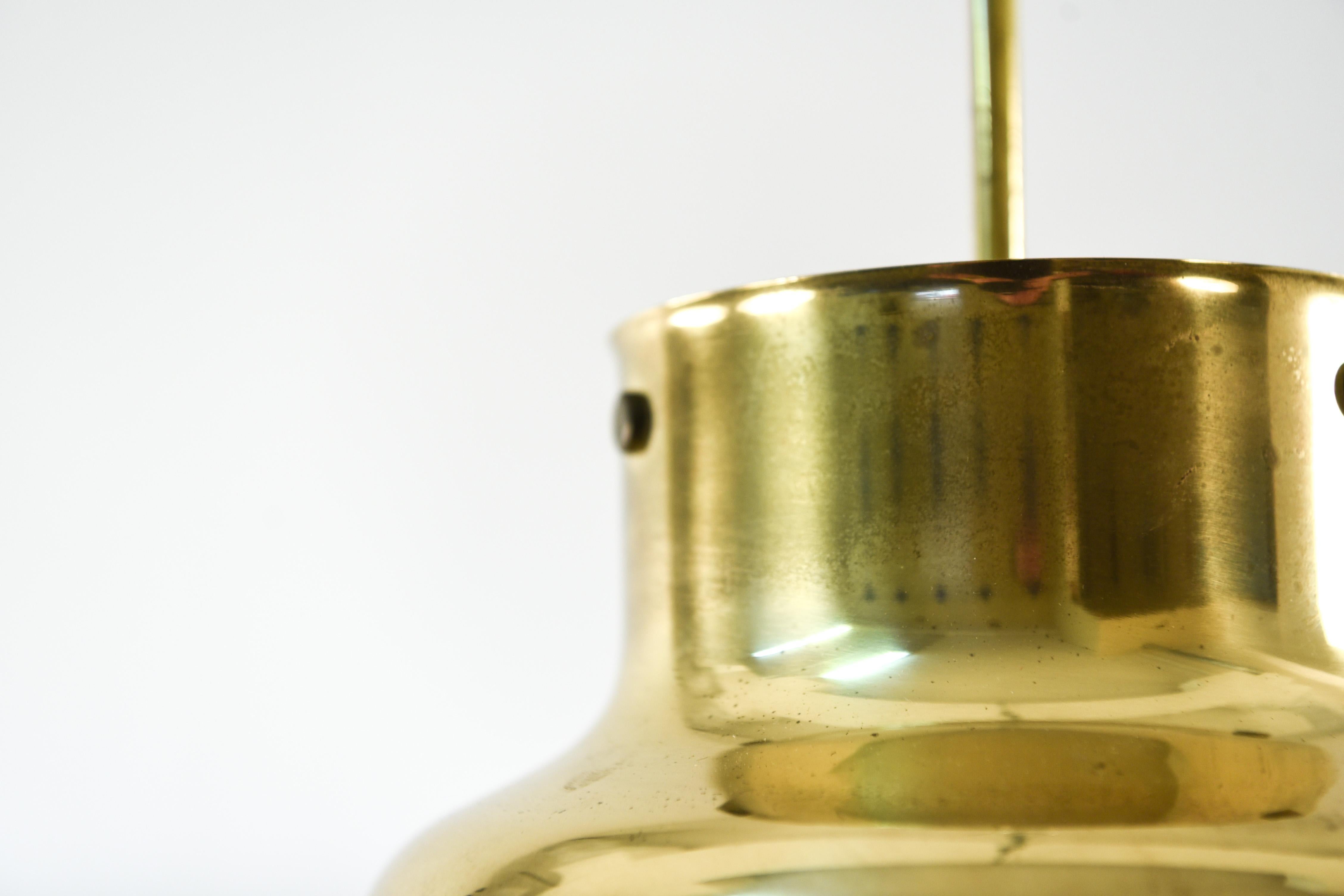 This is a lovely brass ceiling pendant in model 