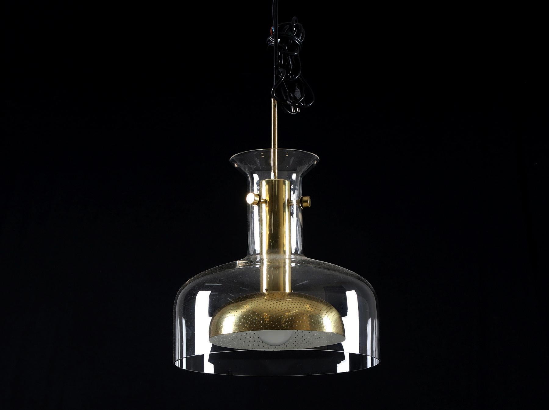 Pendant in glass and perforated brass fitted with one E27 socket up to 100 watts, designed in 1968 by Finnish creator Anders Pehrson for Atelje´ Lyktan, Model 