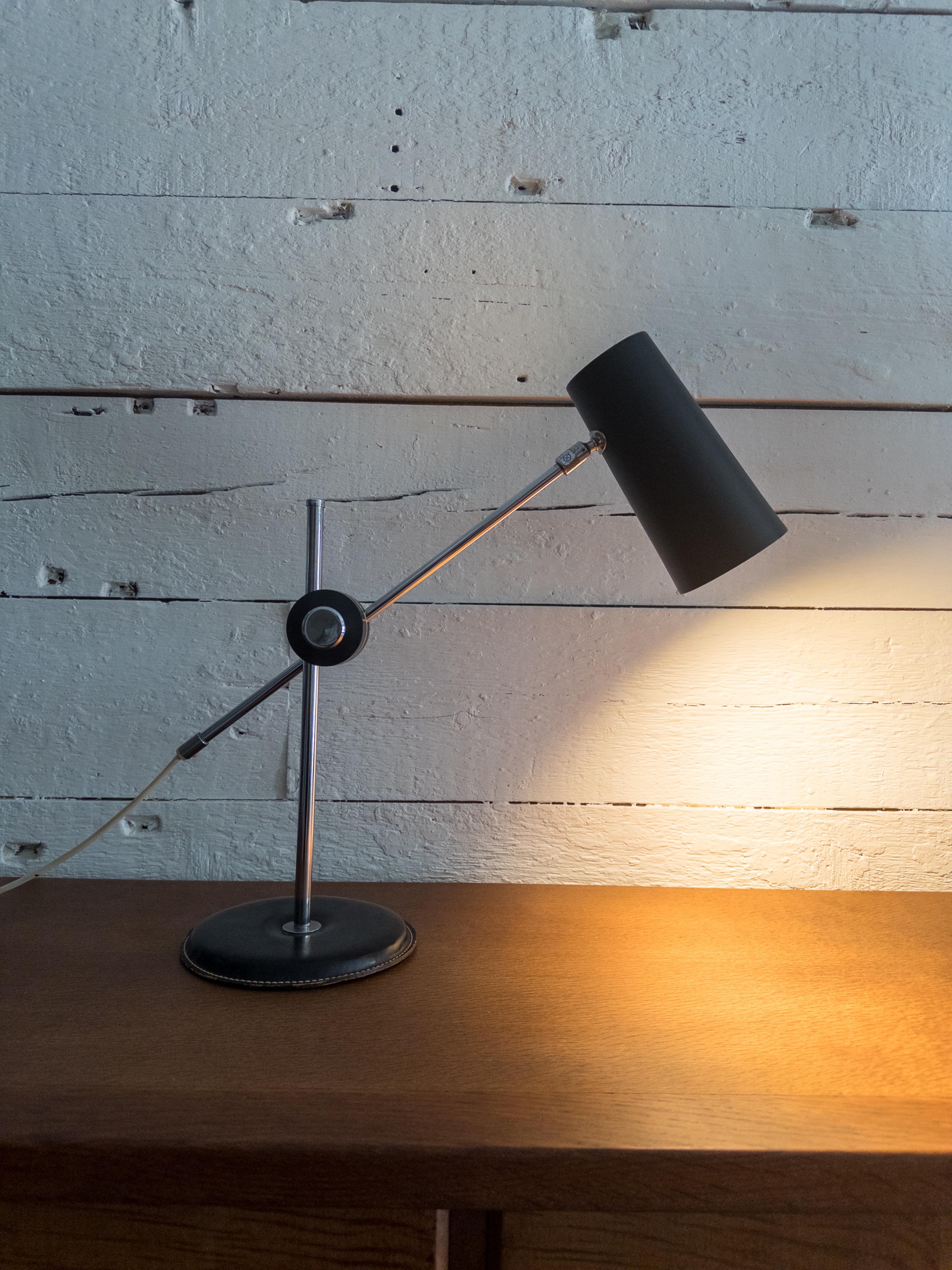 Metal, plastic and black leather table lamp designed by Anders Pehrson and produced by Atelje Lyktan, Sweden, c. 1960s.

