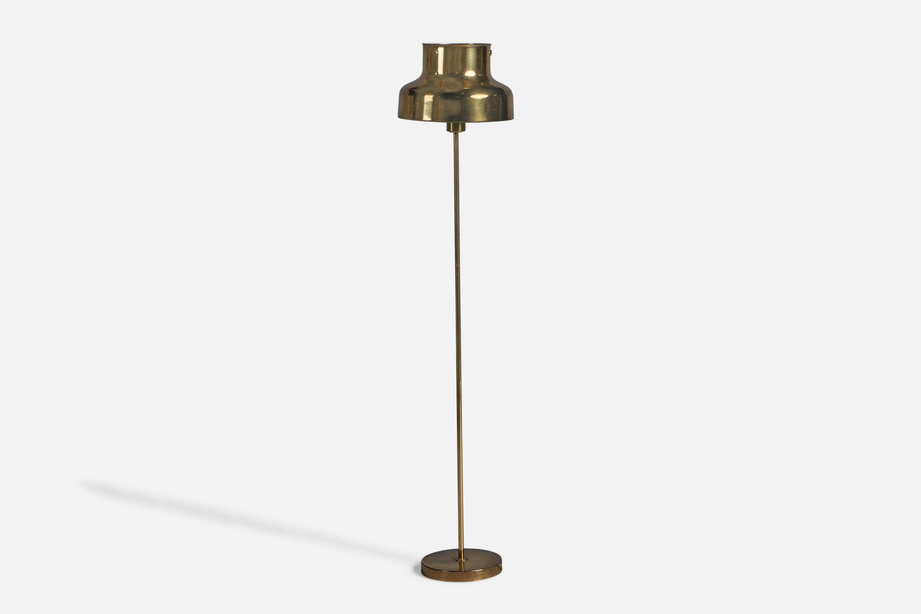 A brass floor lamp designed by Anders Pehrsson and produced by Atelje Lyktan, Sweden, c. 1960s.
Overall Dimensions (inches): 47.5