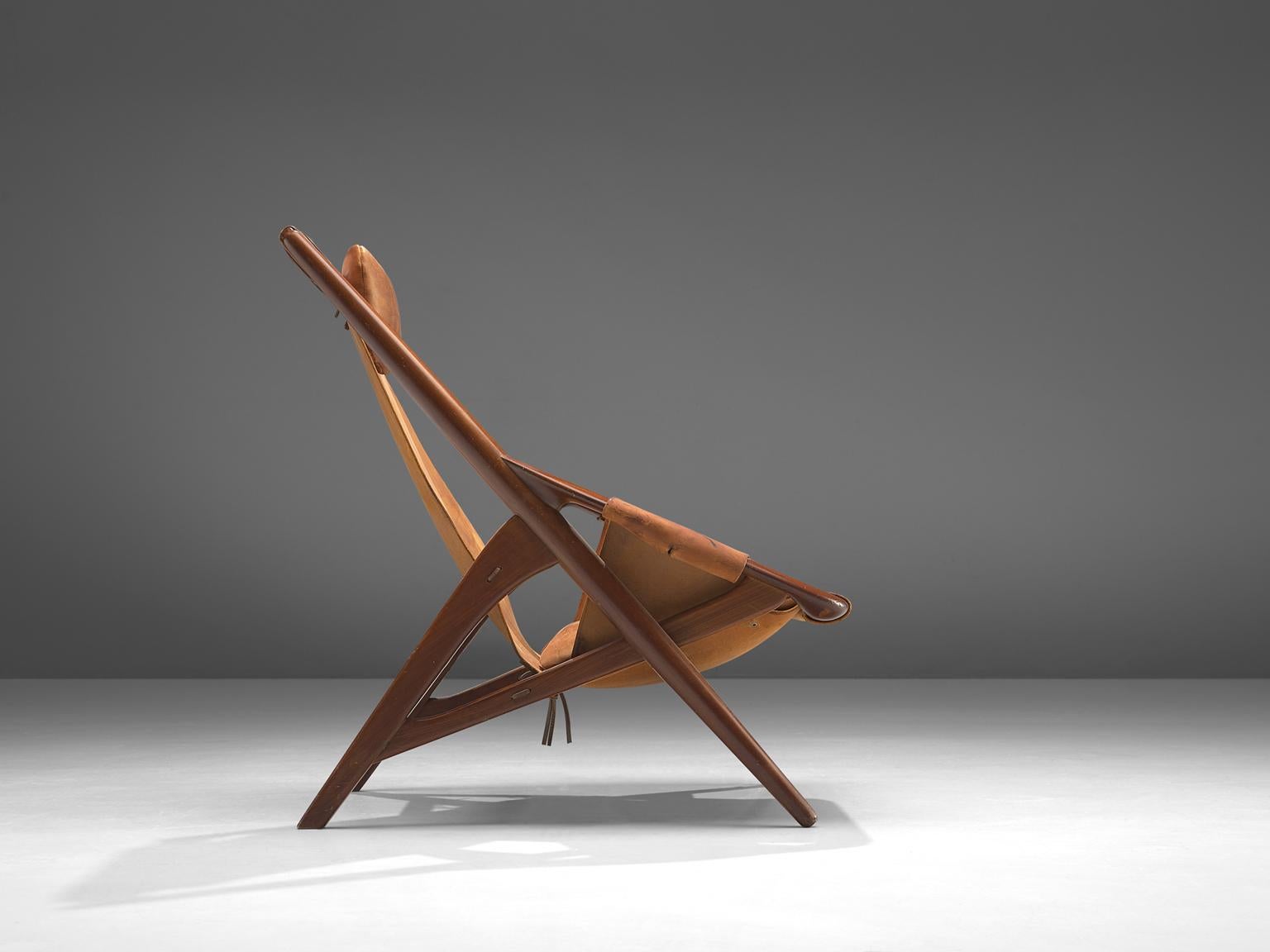 W. Andersag, lounge chair, teak and saddle leather, Italy, 1960s.

This chair is very dynamic due it's design and shapes. The teak frame shows beautiful lines. The frame and construction reminds of the sturdy hunting chairs. Thick saddle leather is