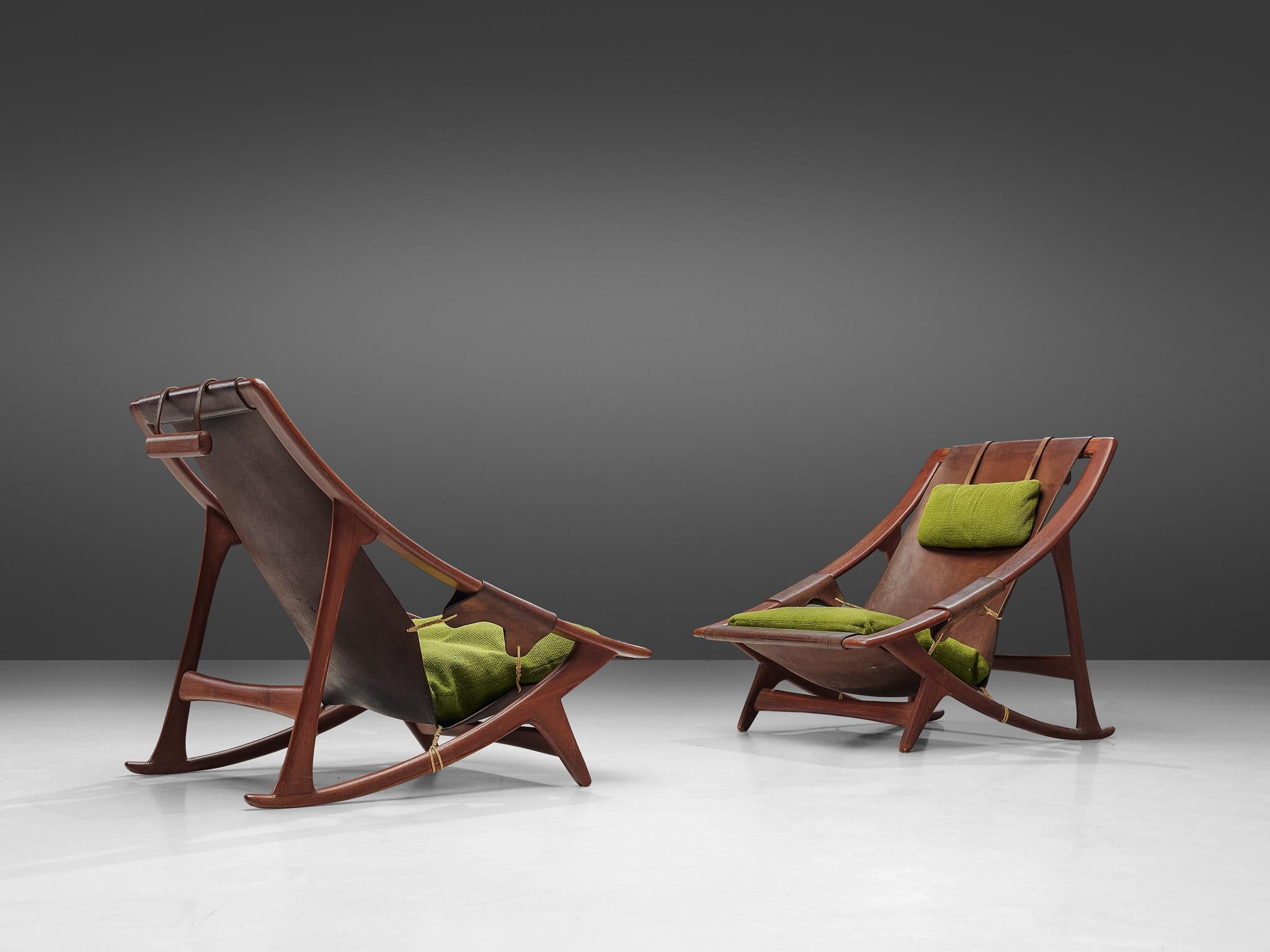 W. Andersag, set of 2 lounge chairs, teak, fabric and saddle leather, Italy, 1960s

These chairs are very dynamic due it's design and shapes. The teak frame shows beautiful lines. The frame and construction reminds of the sturdy hunting chairs.