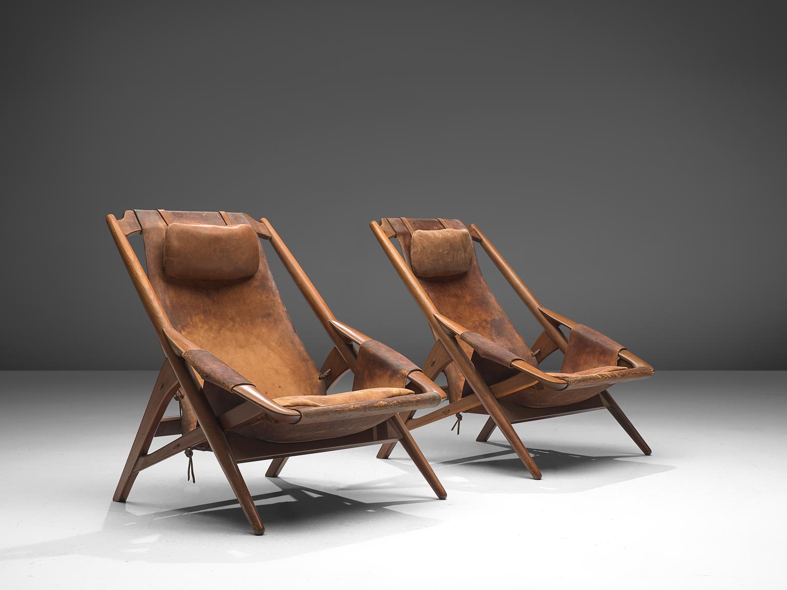 W. Andersag, set of lounge chairs, teak and saddle leather, Italy, 1960s

These chairs are very dynamic due it's design and shapes. The teak frame shows beautiful lines. The frame and construction reminds of the sturdy hunting chairs. Thick saddle