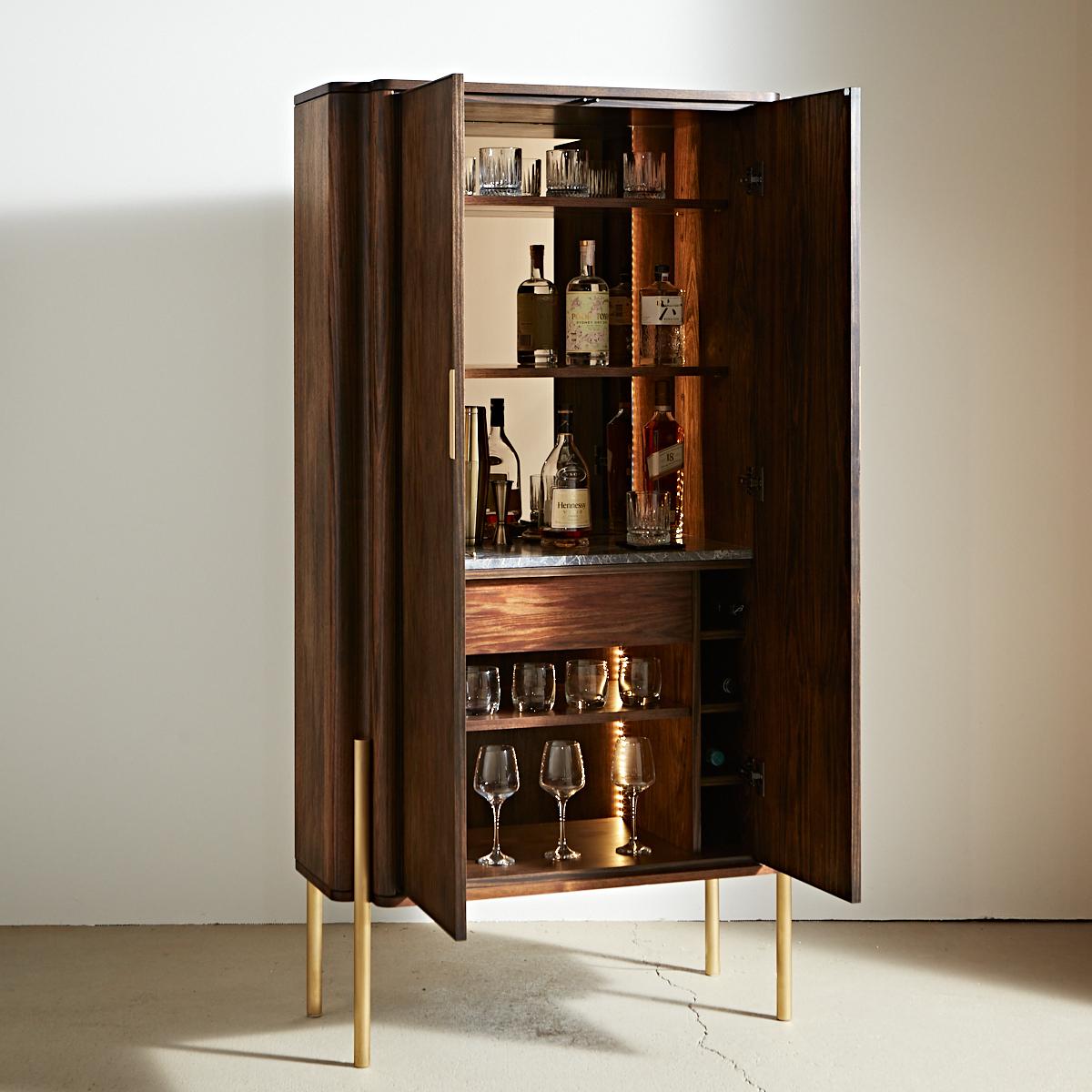 A uniquely Australian take on smoking jacket luxury, this tall bar room centrepiece can be crafted in a range of custom hardwoods with brass accents which age gracefully and develop a beautiful soft patina unique to its time with you.

Designed for