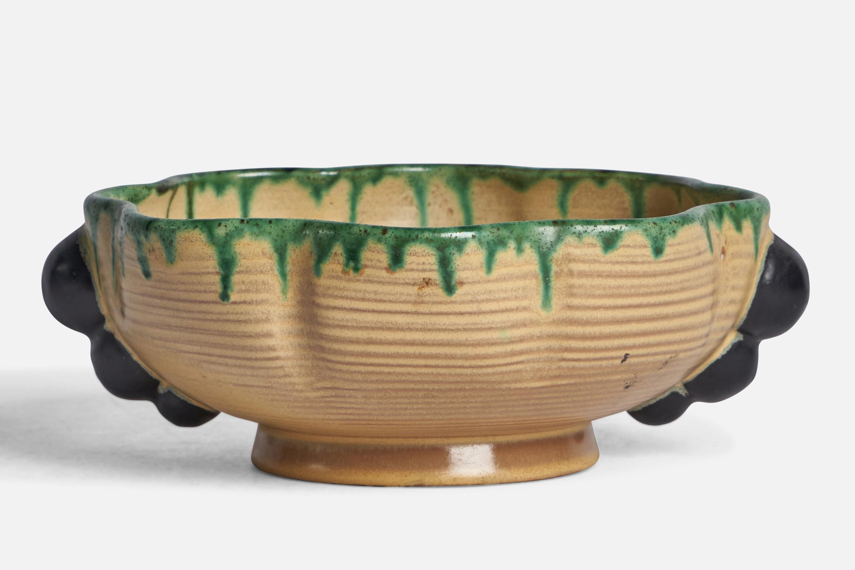 A green beige and black-glazed incised stoneware bowl designed and produced by Andersson & Johansson, Sweden, 1950s.