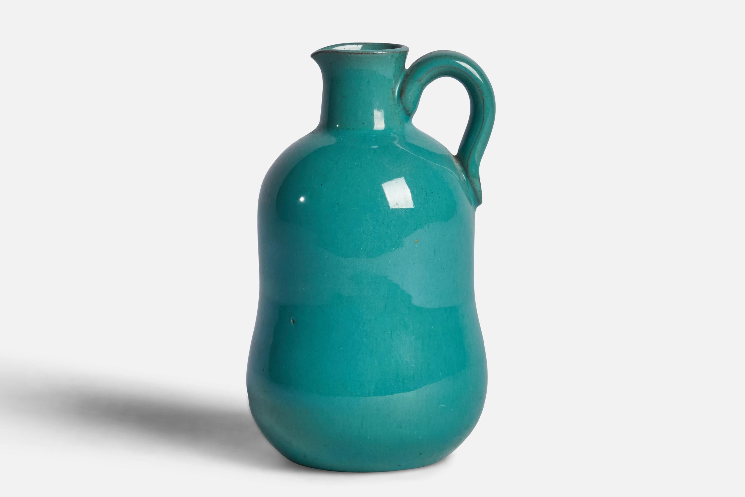A small blue-glazed stoneware pitcher designed and produced by Andersson & Johansson, Sweden, 1940s.