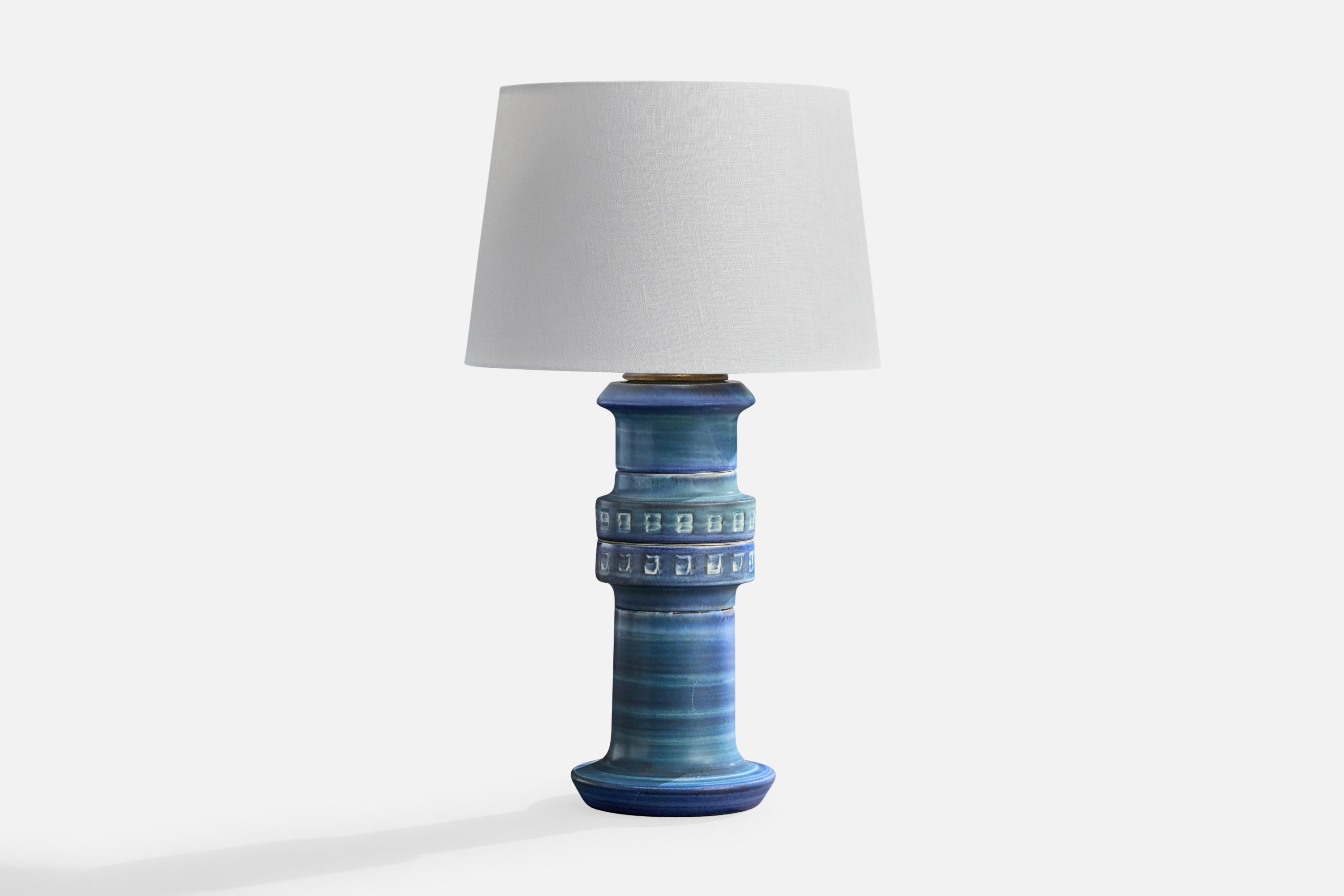 A blue-glazed ceramic and brass table lamp produced by Andersson & Johansson, Höganäs, Sweden, c. 1970s.

Dimensions of Lamp (inches): 15.5