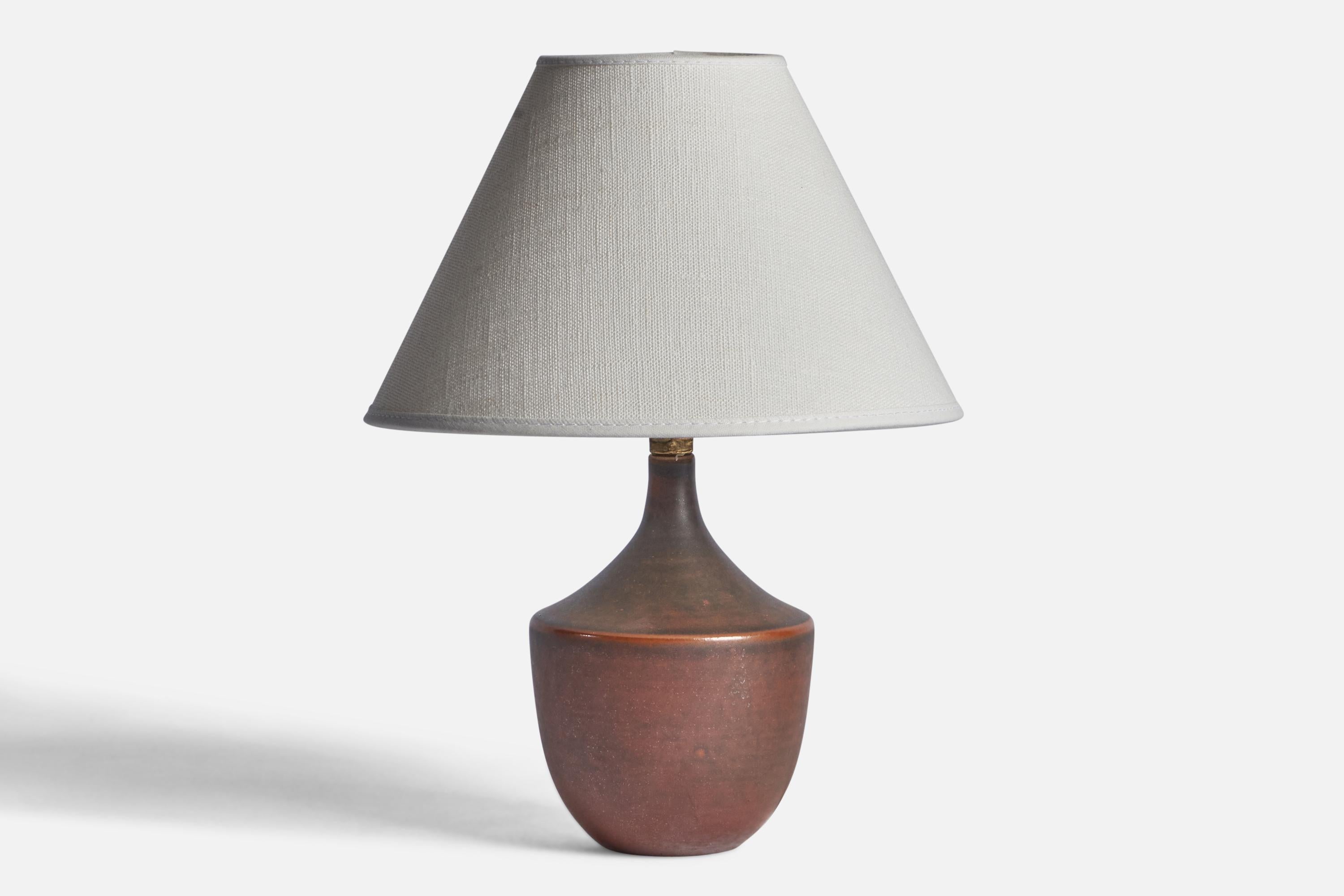 A brown-glazed stoneware table lamp designed and produced by Andersson & Johansson, Höganäs, Sweden, c. 1940s.

Dimensions of Lamp (inches): 7.75” H x 3.85” Diameter
Dimensions of Shade (inches): 3” Top Diameter x 8” Bottom Diameter x 5” H